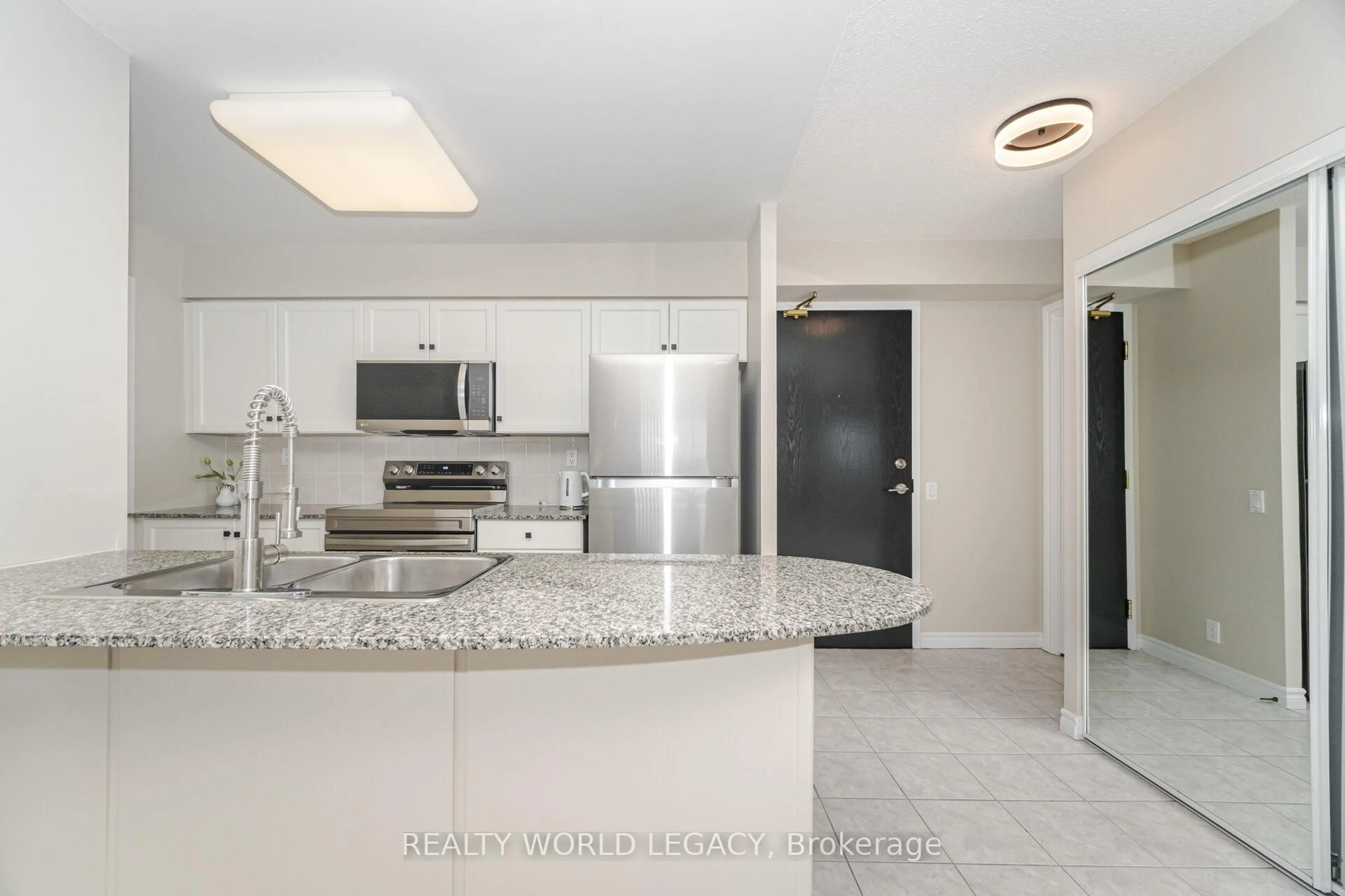Open concept kitchen, ceramic/tile floor for 1720 Eglinton Ave #610, Toronto Ontario M4A 2X8