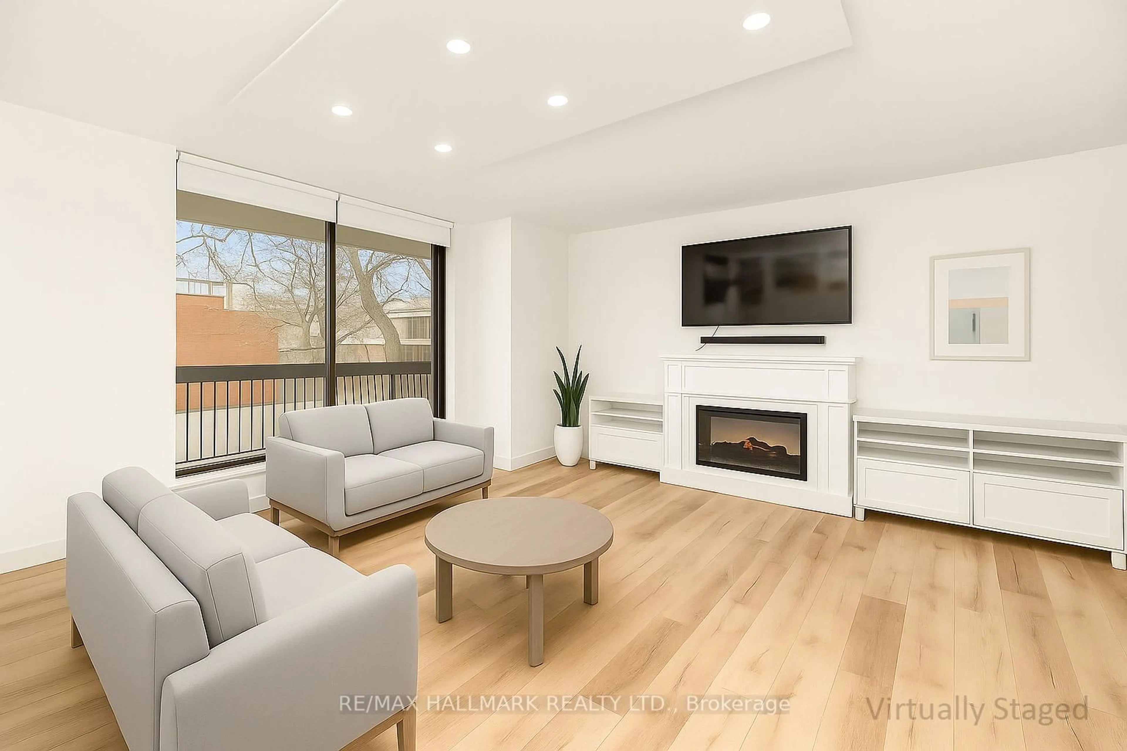 Living room with furniture, wood/laminate floor for 212 St George St #203, Toronto Ontario M5R 2N5