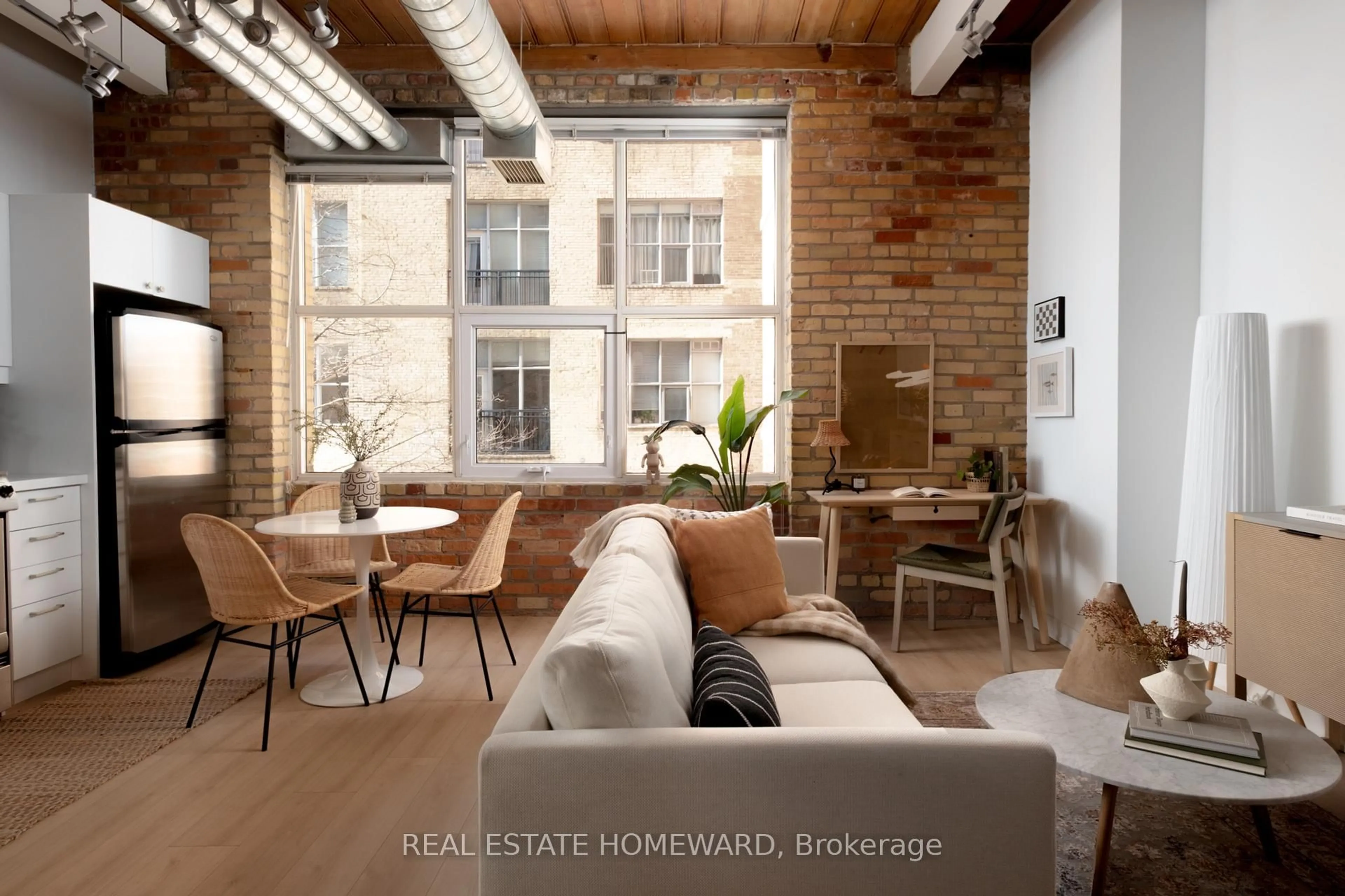 Living room with furniture, cement floor for 955 Queen St #321, Toronto Ontario M6J 3X5