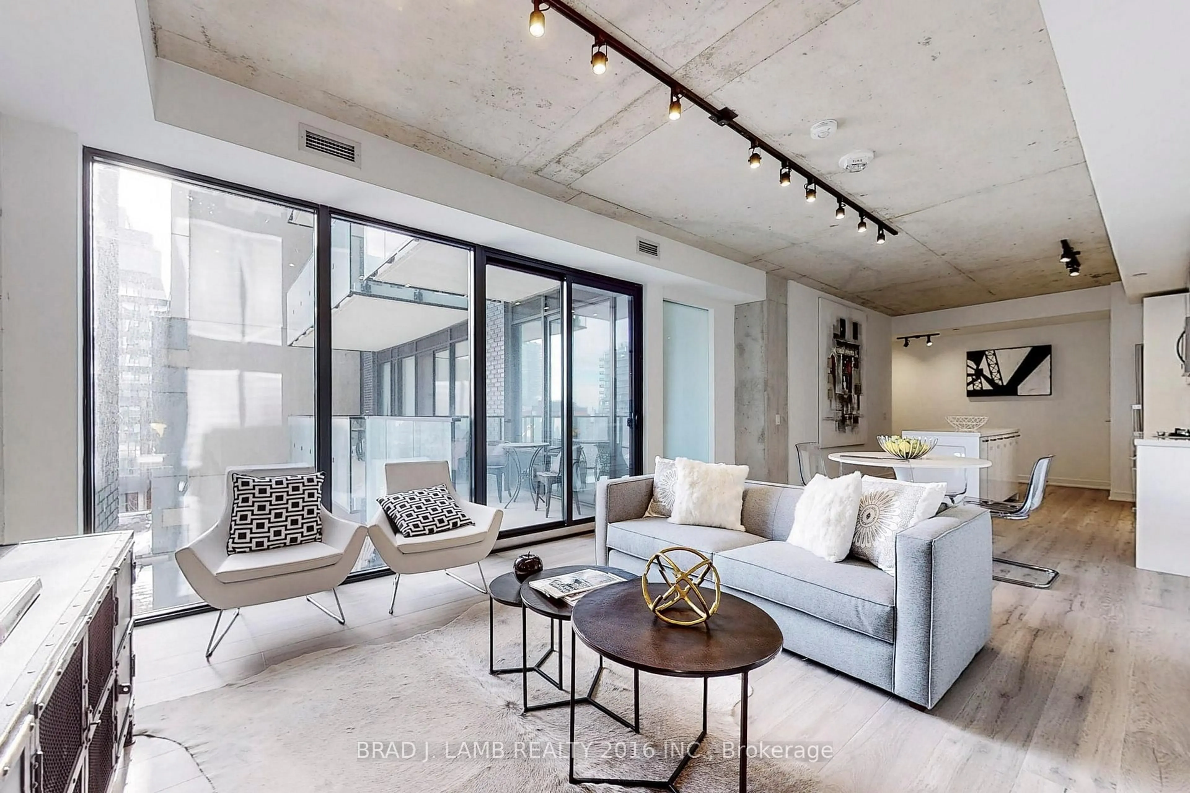 Living room with furniture, cement floor for 55 Ontario St #509, Toronto Ontario M5A 0T8