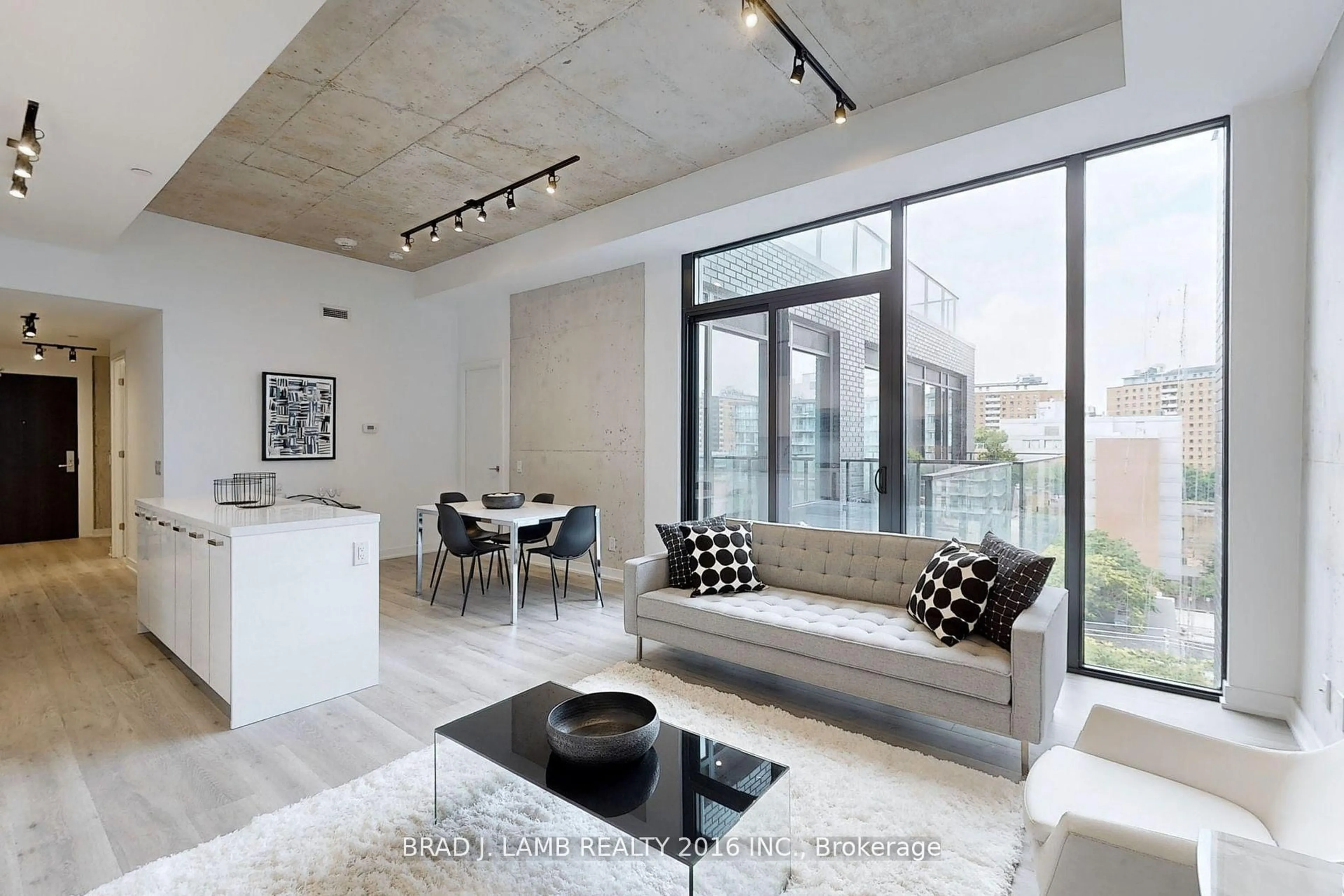 Living room with furniture, cement floor for 55 Ontario St #621, Toronto Ontario M5A 0T8