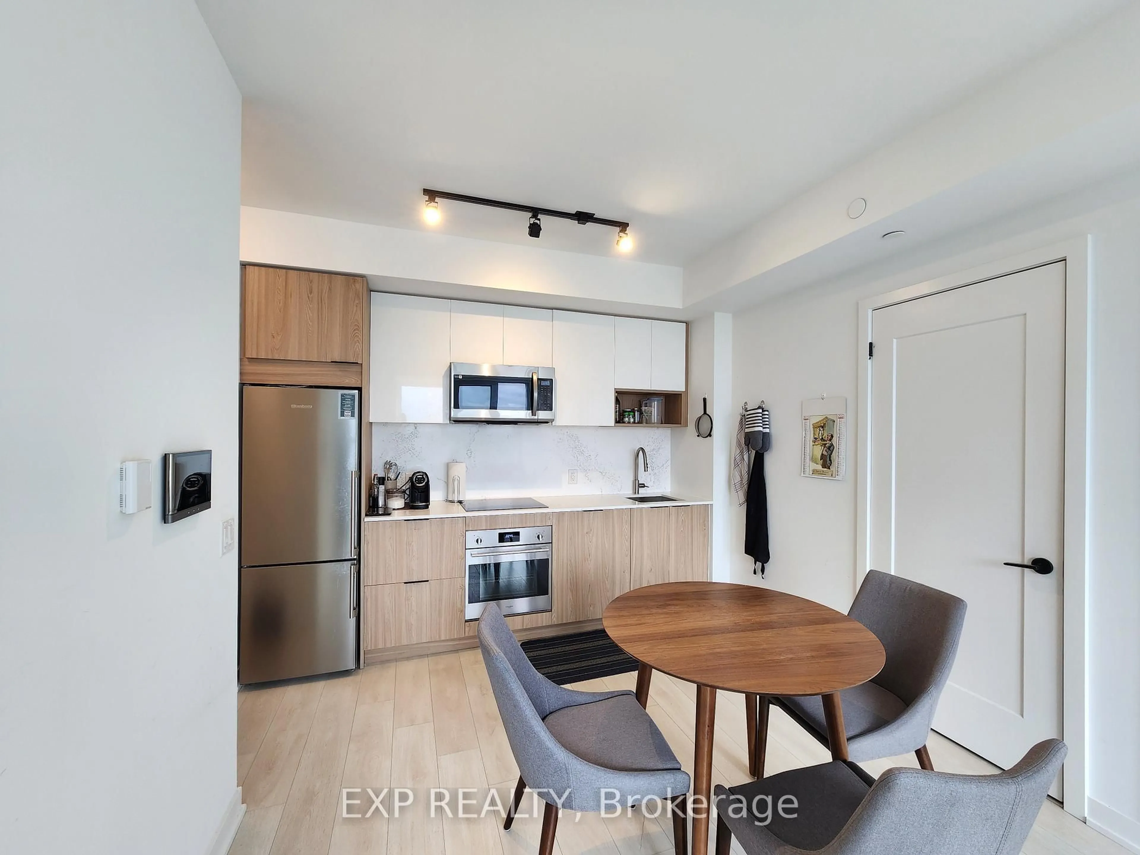 Open concept kitchen, wood/laminate floor for 5 Defries St #3012, Toronto Ontario M5A 0W7