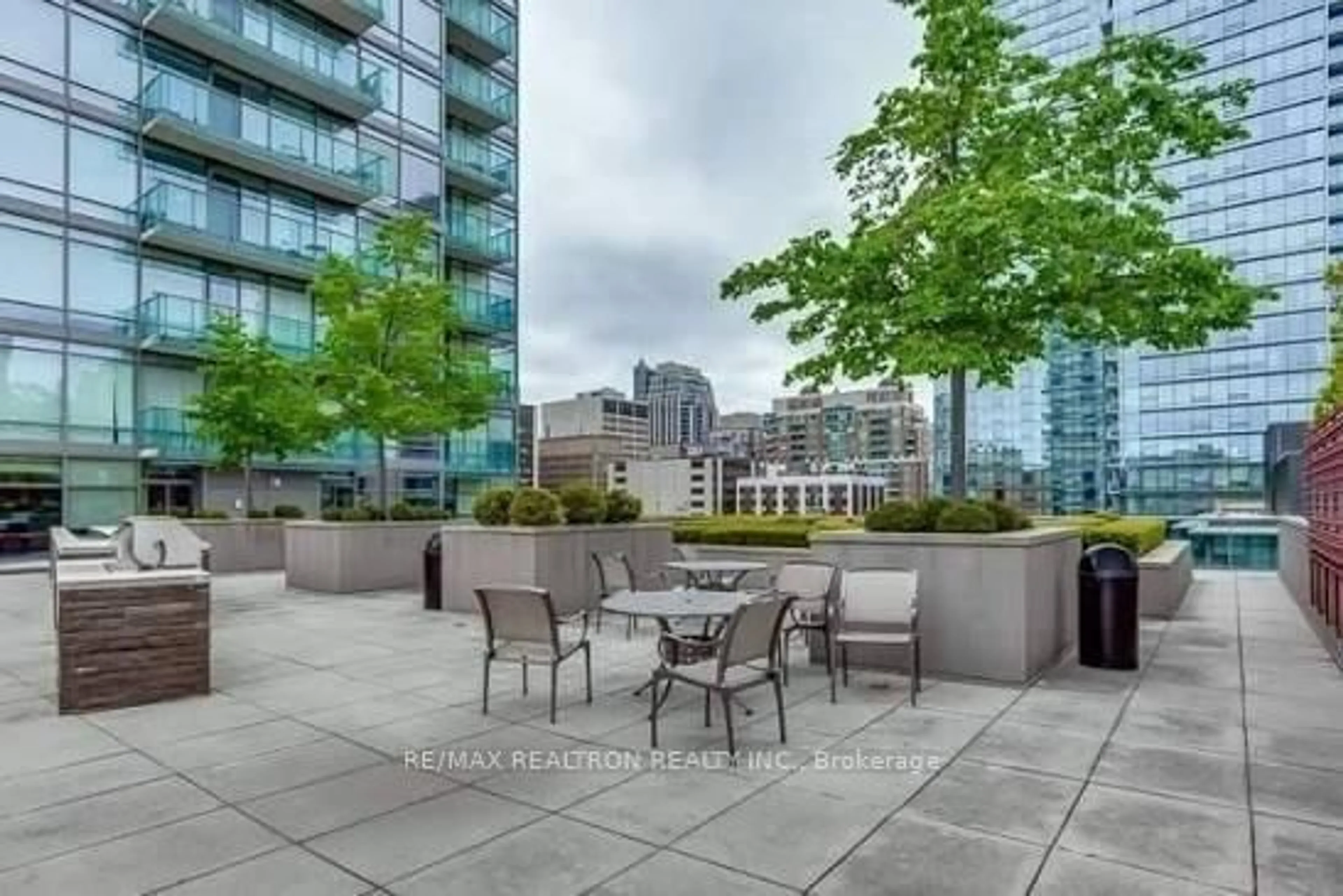 Patio, city buildings view from balcony for 18 Yorkville Ave #1008, Toronto Ontario M4W 3Y8