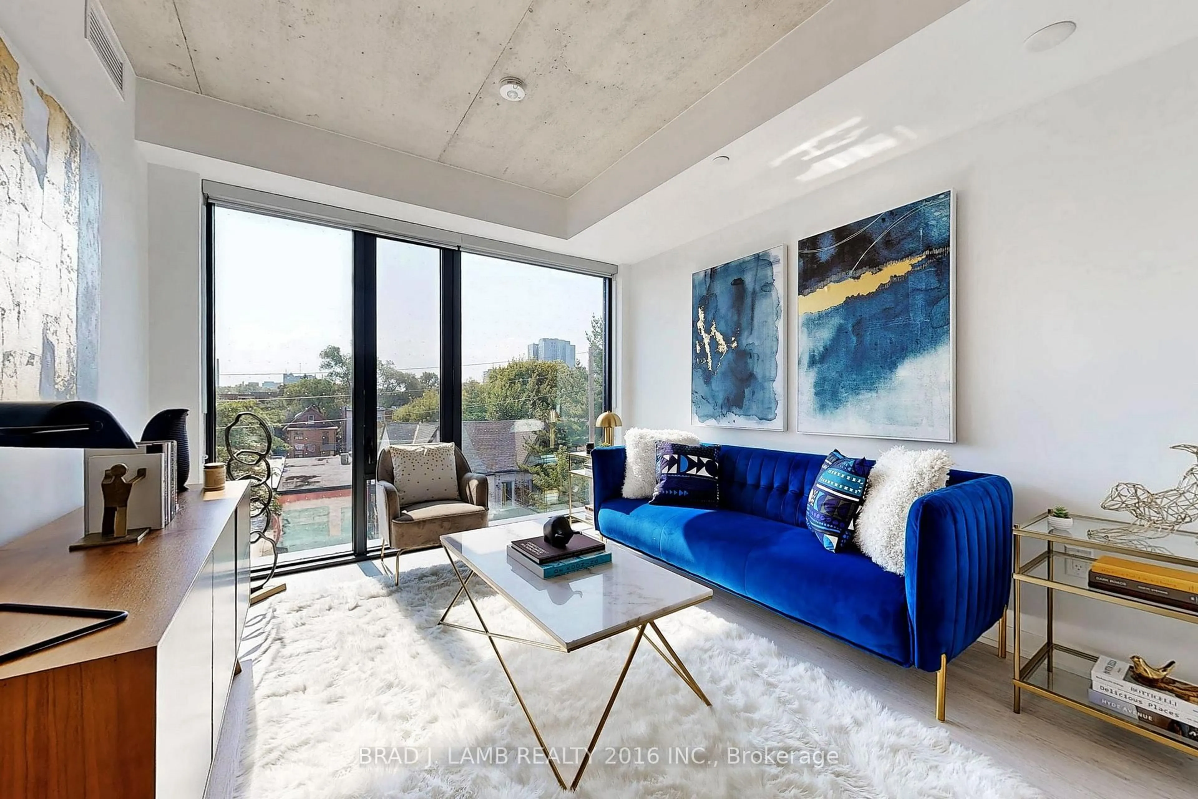 Living room with furniture, cement floor for 195 McCaul St #302, Toronto Ontario M5T 0E5