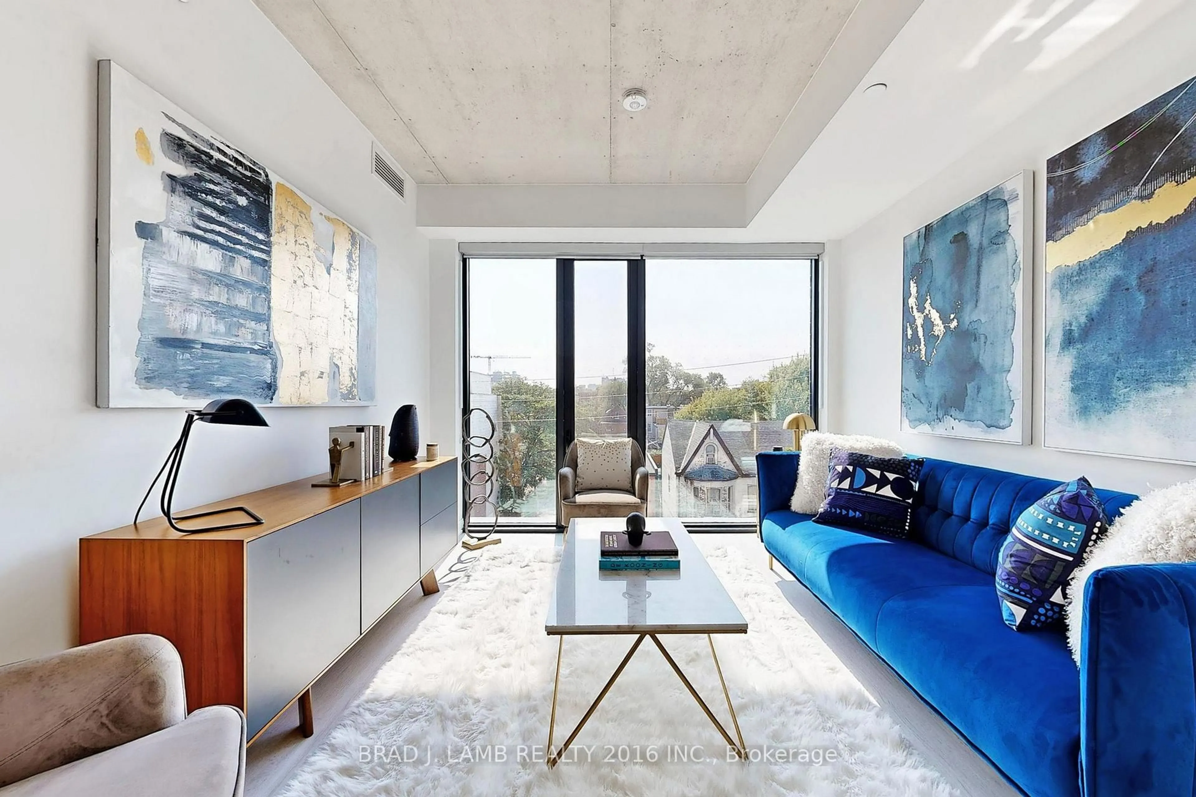 Living room with furniture, cement floor for 195 McCaul St #302, Toronto Ontario M5T 0E5