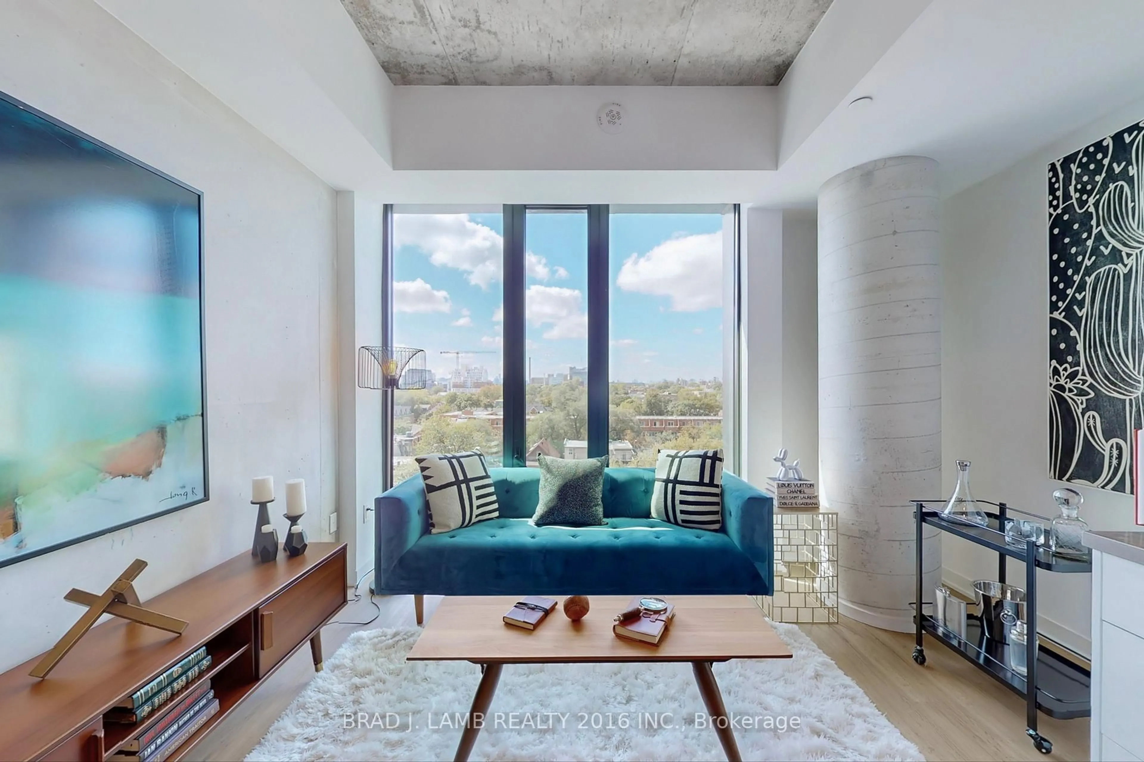 Living room with furniture, cement floor for 195 McCaul St #705, Toronto Ontario M5T 0E5