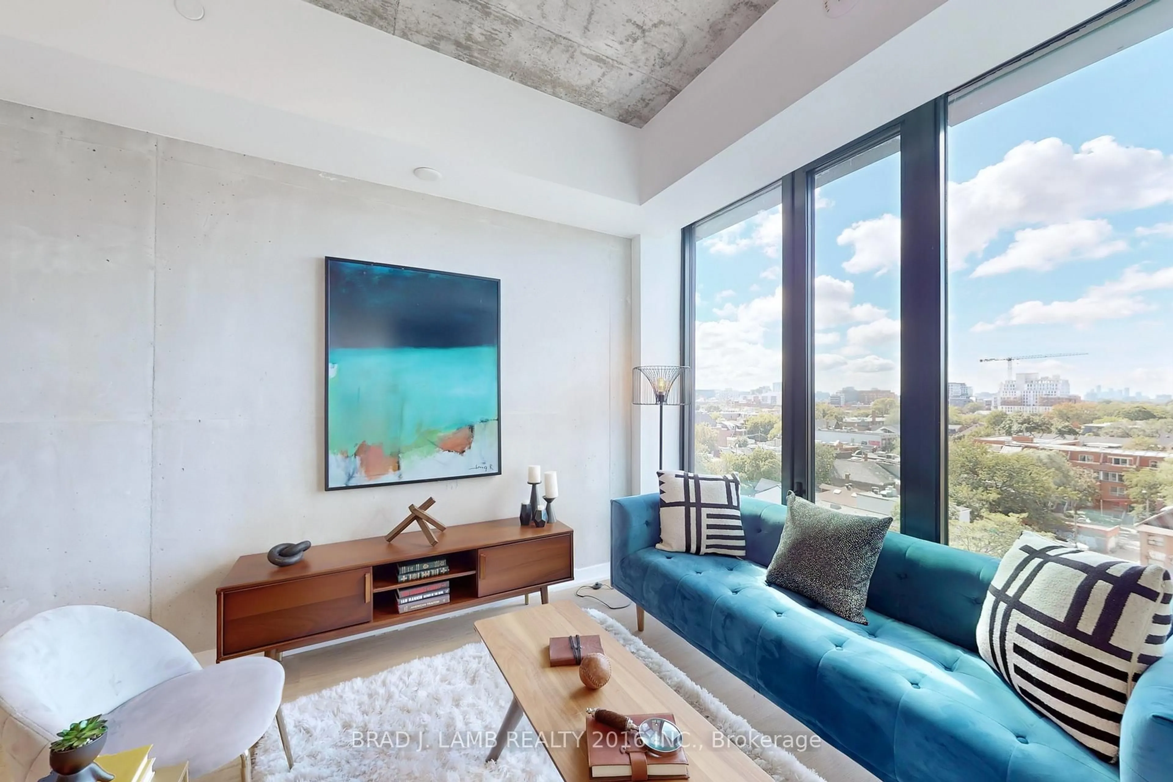 Living room with furniture, cement floor for 195 McCaul St #705, Toronto Ontario M5T 0E5