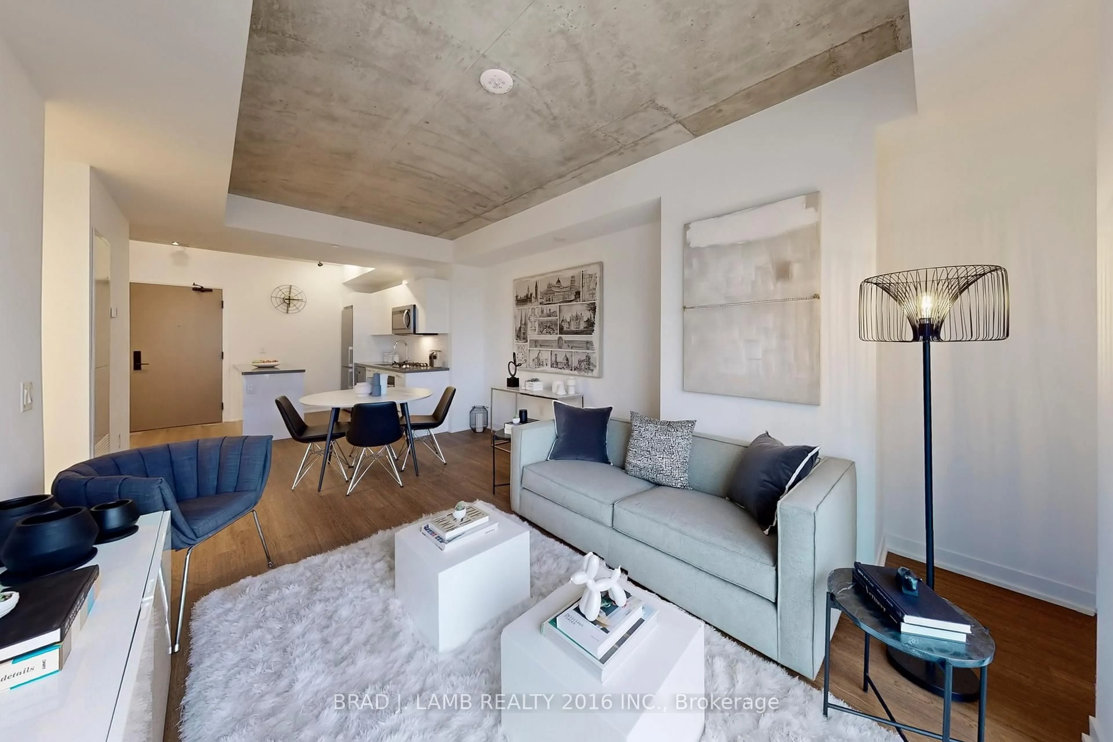 Living room with furniture, cement floor for 195 McCaul St #1403, Toronto Ontario M5T 0E5