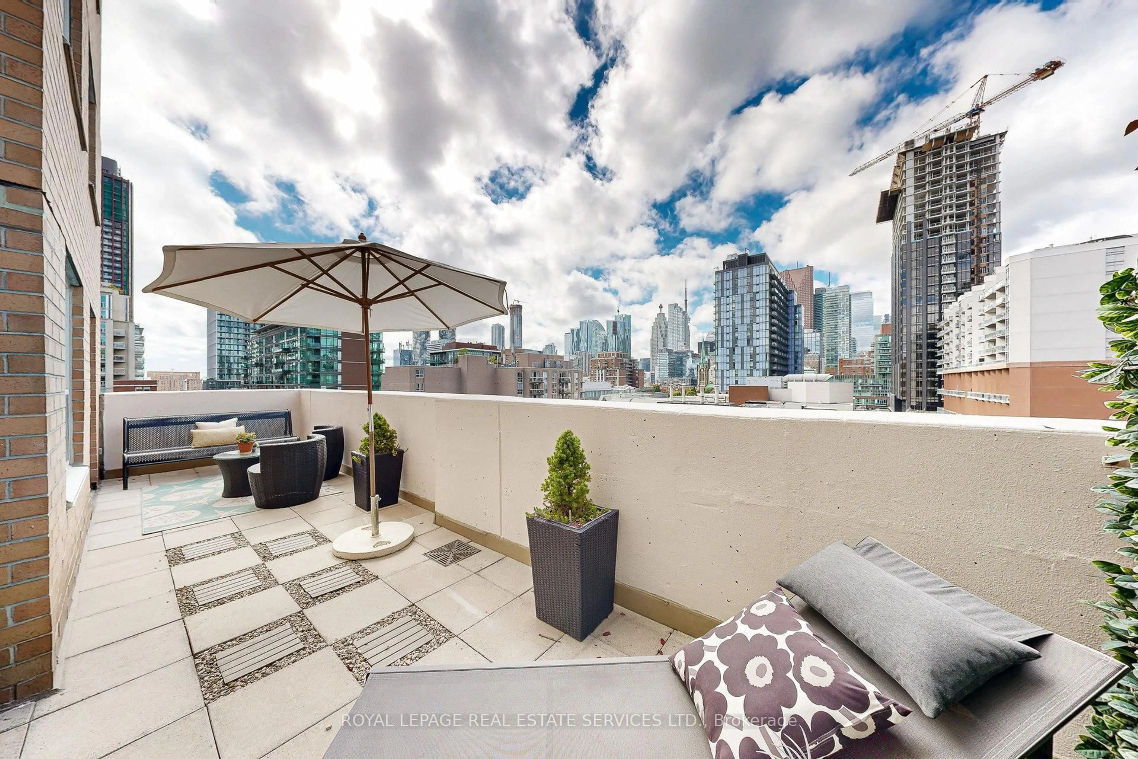 Patio, city buildings view from balcony for 313 Richmond St #1061, Toronto Ontario M5A 4S7