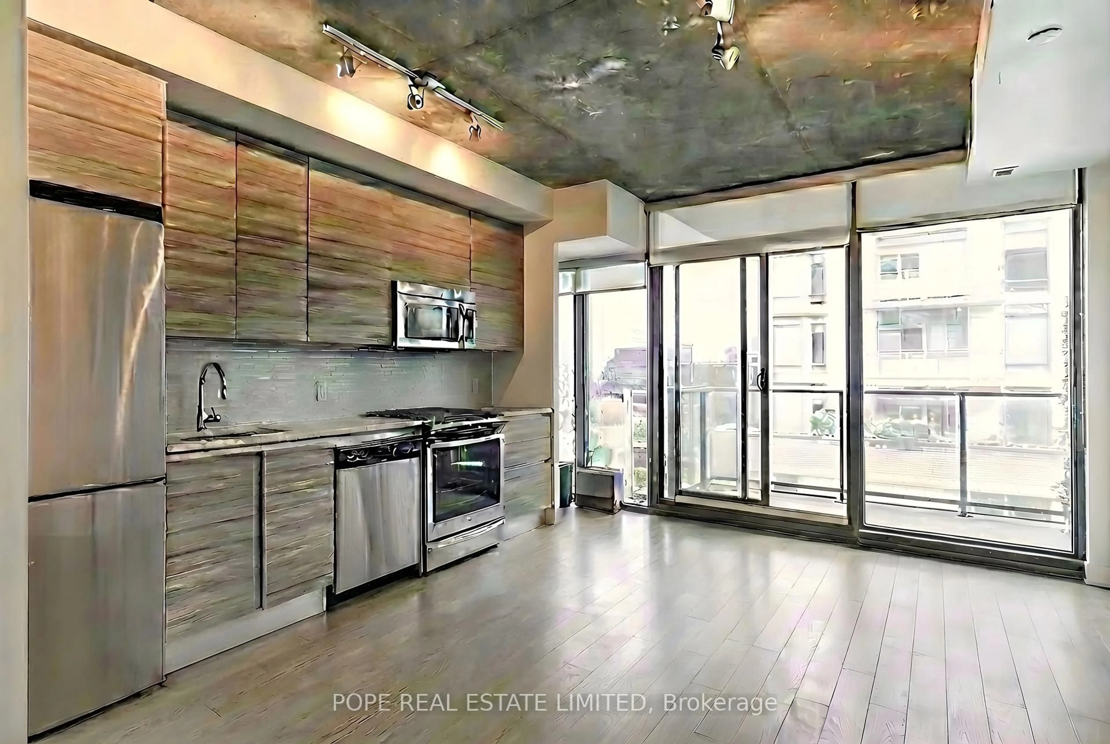 Open concept kitchen, cement floor for 111 Bathurst St #1408, Toronto Ontario M5V 0M9