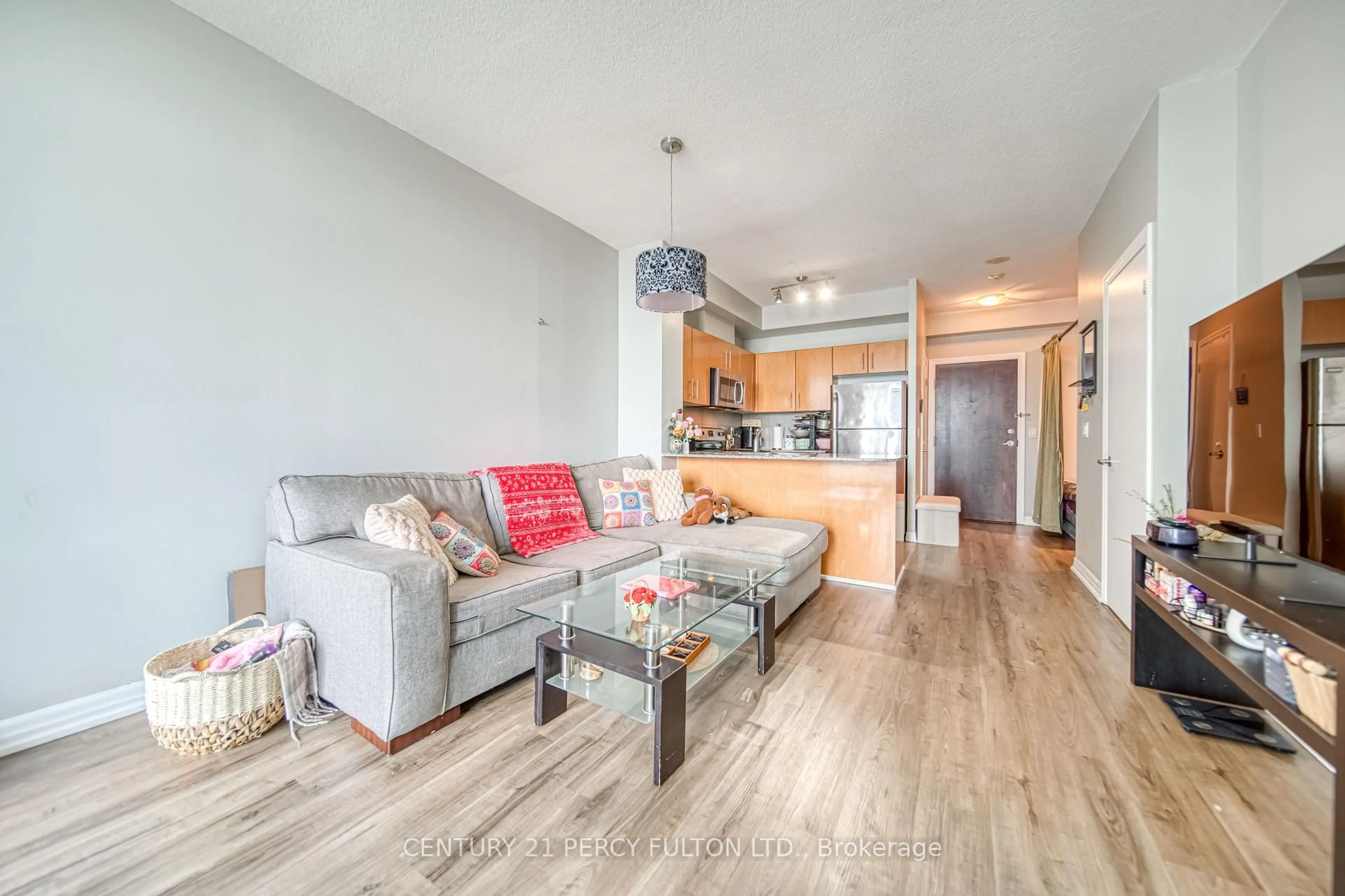 Living room with furniture, wood/laminate floor for 16 Yonge St #3407, Toronto Ontario M5E 2A1