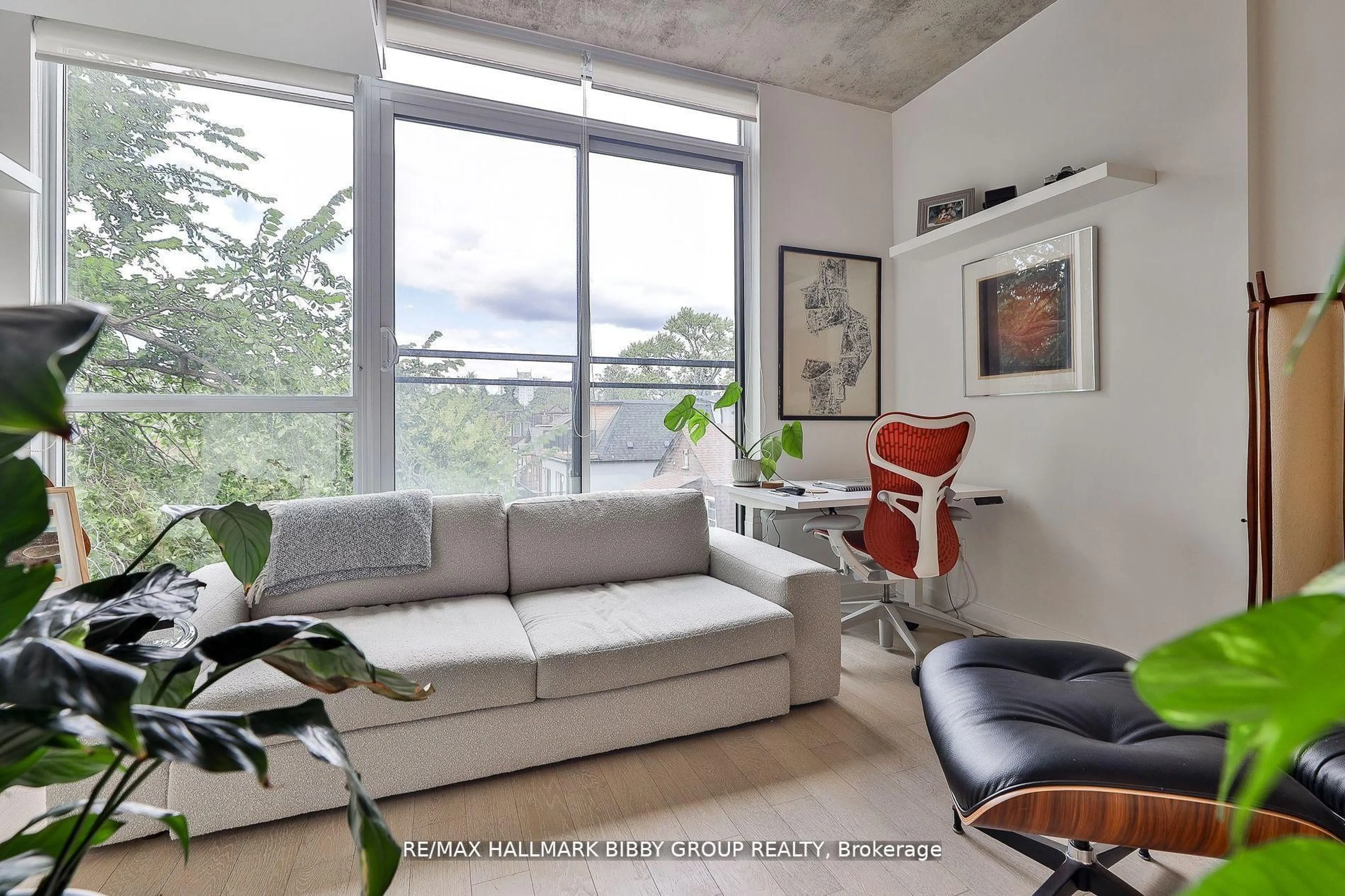 Living room with furniture, cement floor for 130 Rusholme Rd #309, Toronto Ontario M6H 1A7