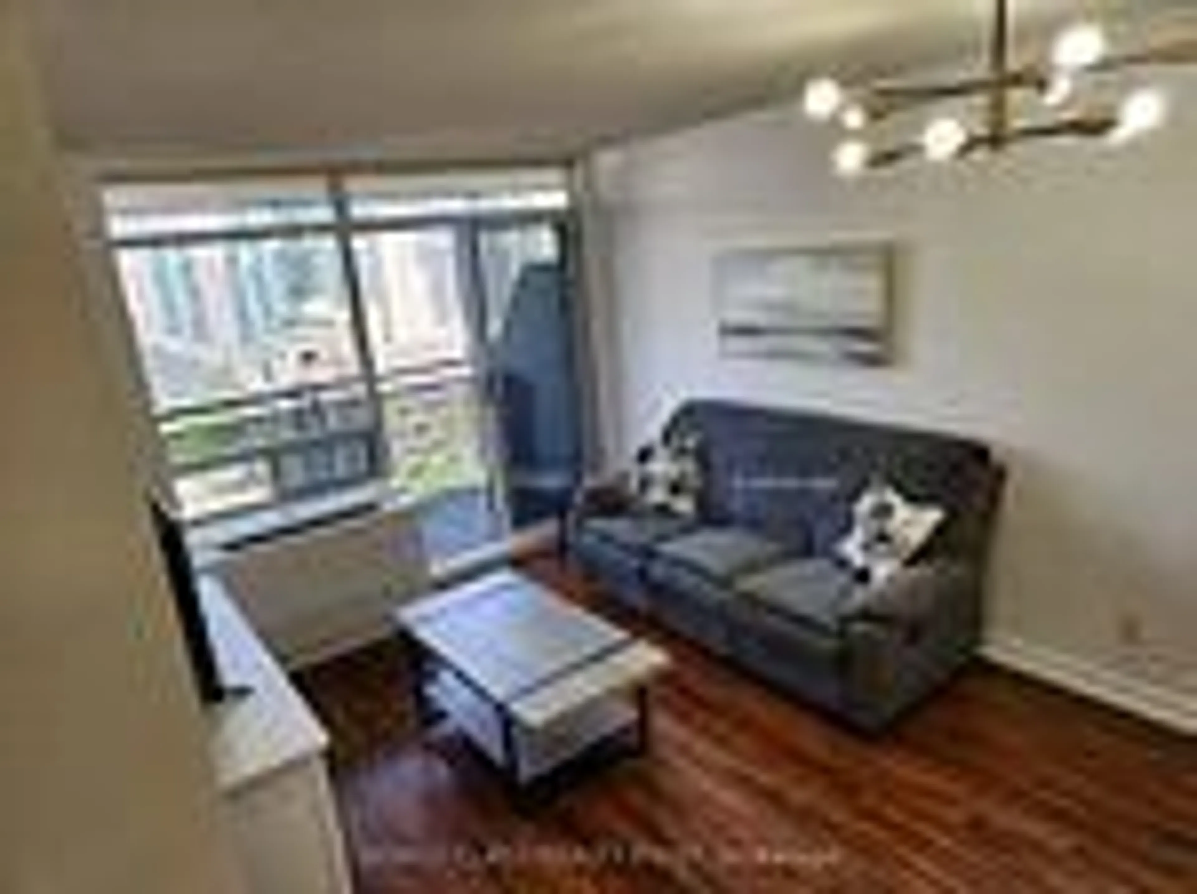 Living room with furniture, wood/laminate floor for 155 Beecroft Rd #1807, Toronto Ontario M2N 7C6