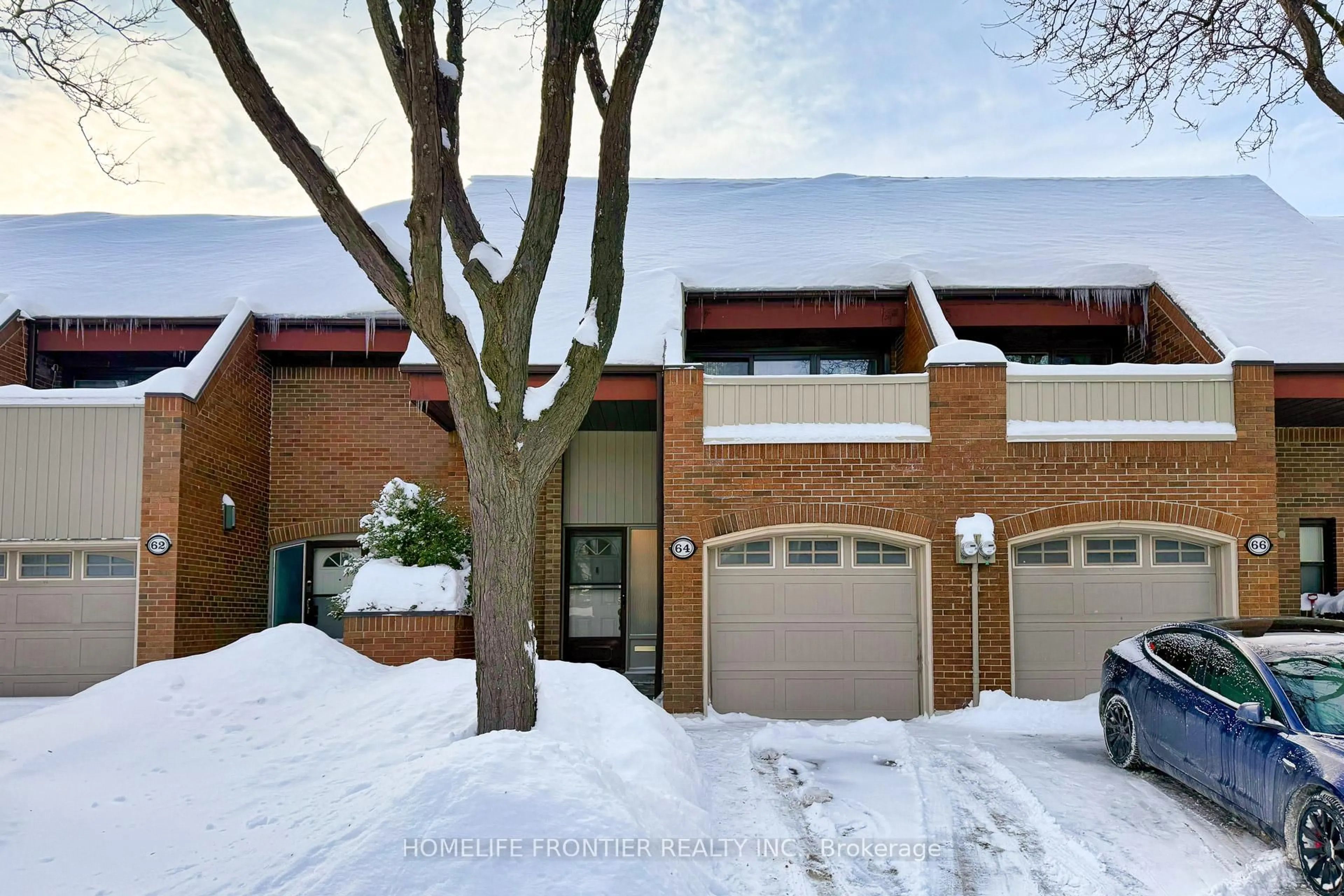 Home with brick exterior material, street for 64 Flaming Roseway, Toronto Ontario M2N 5W8