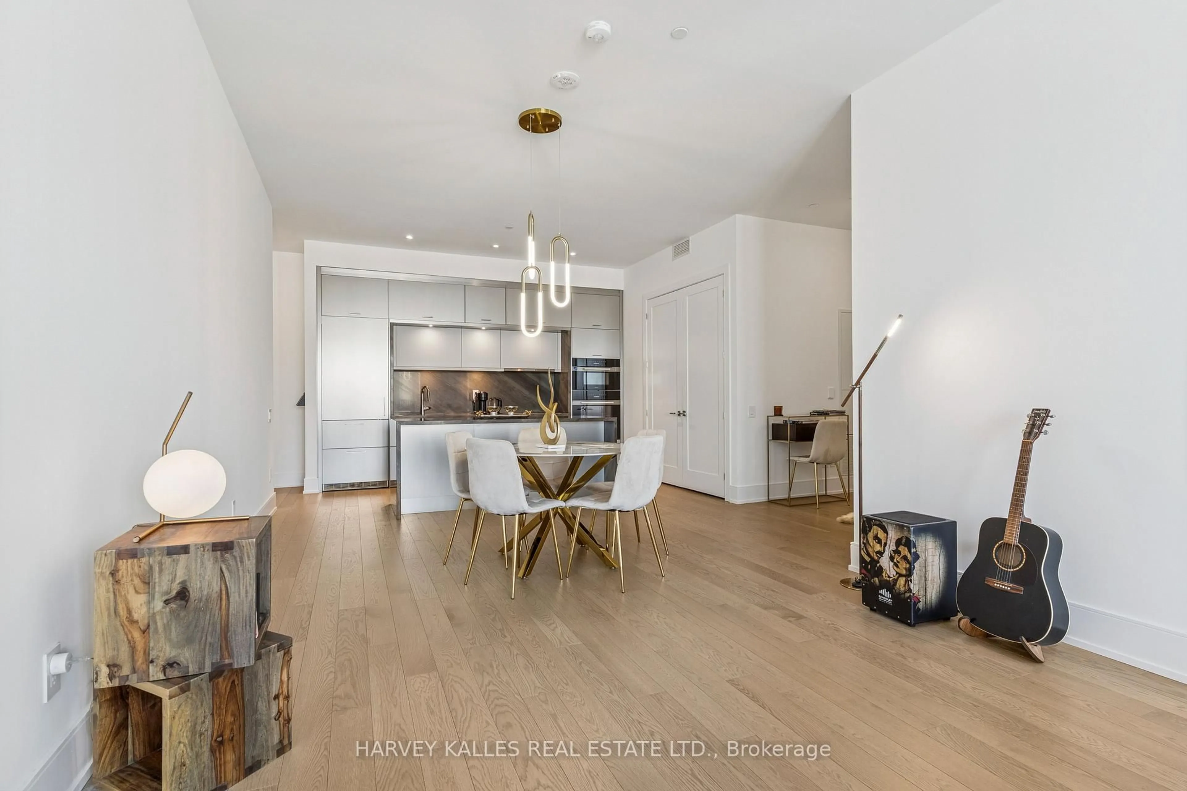 Open concept kitchen, wood/laminate floor for 155 Merchant's Wharf Ave #701, Toronto Ontario M5A 0Y4
