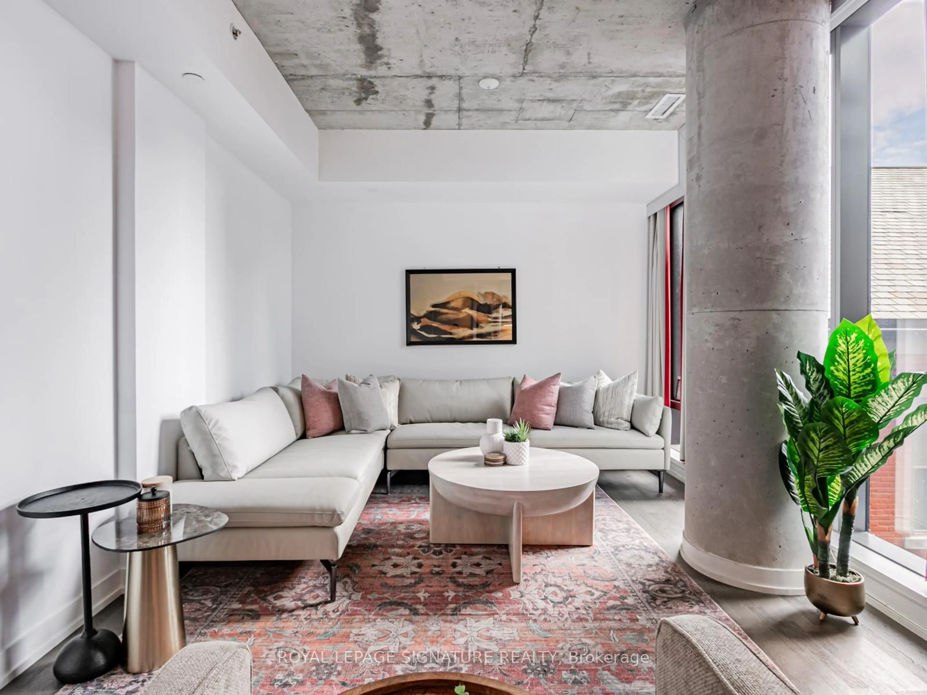 Living room with furniture, cement floor for 560 King St #418, Toronto Ontario M5V 0L5