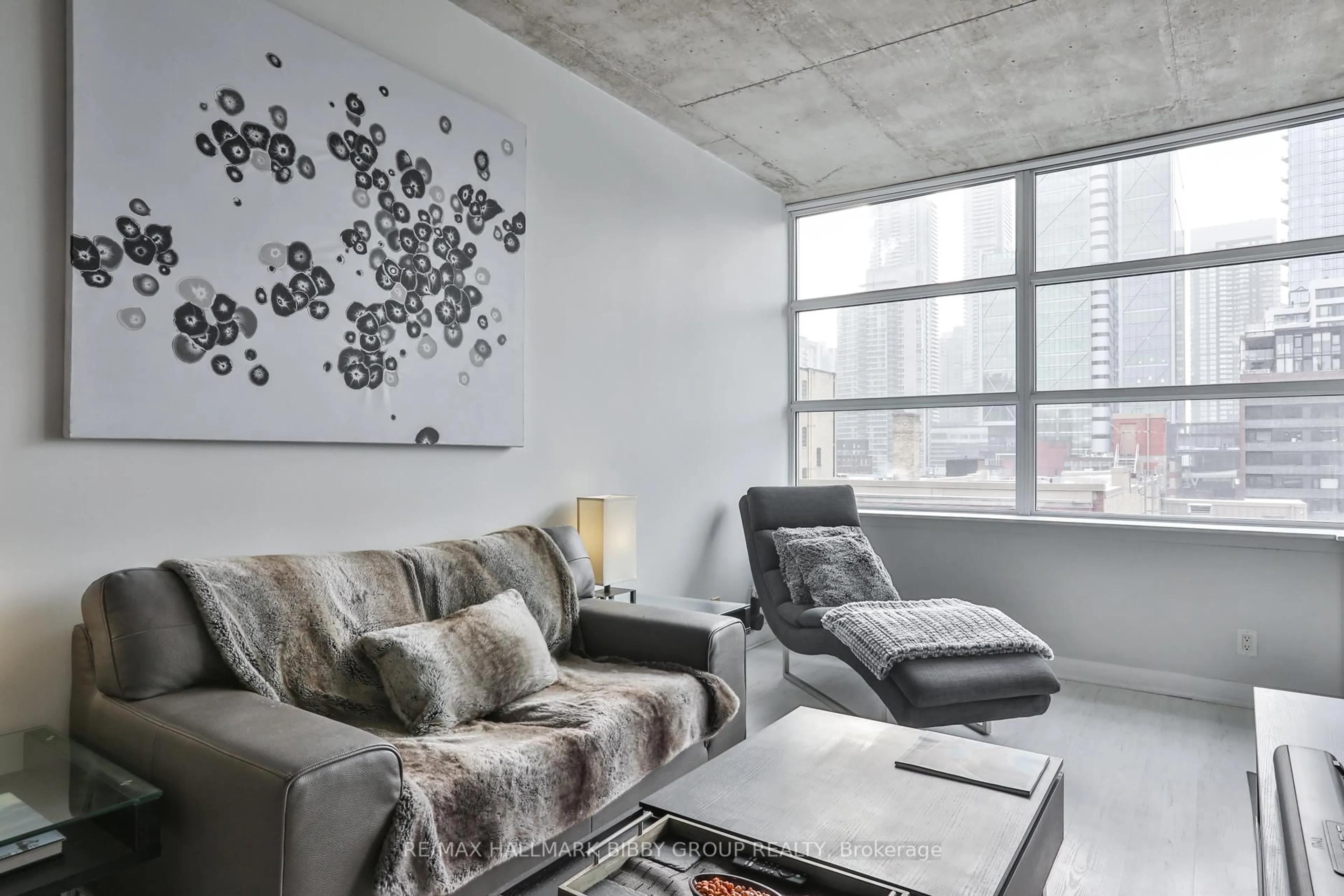 Living room with furniture, cement floor for 478 King St #606, Toronto Ontario M5V 0A8