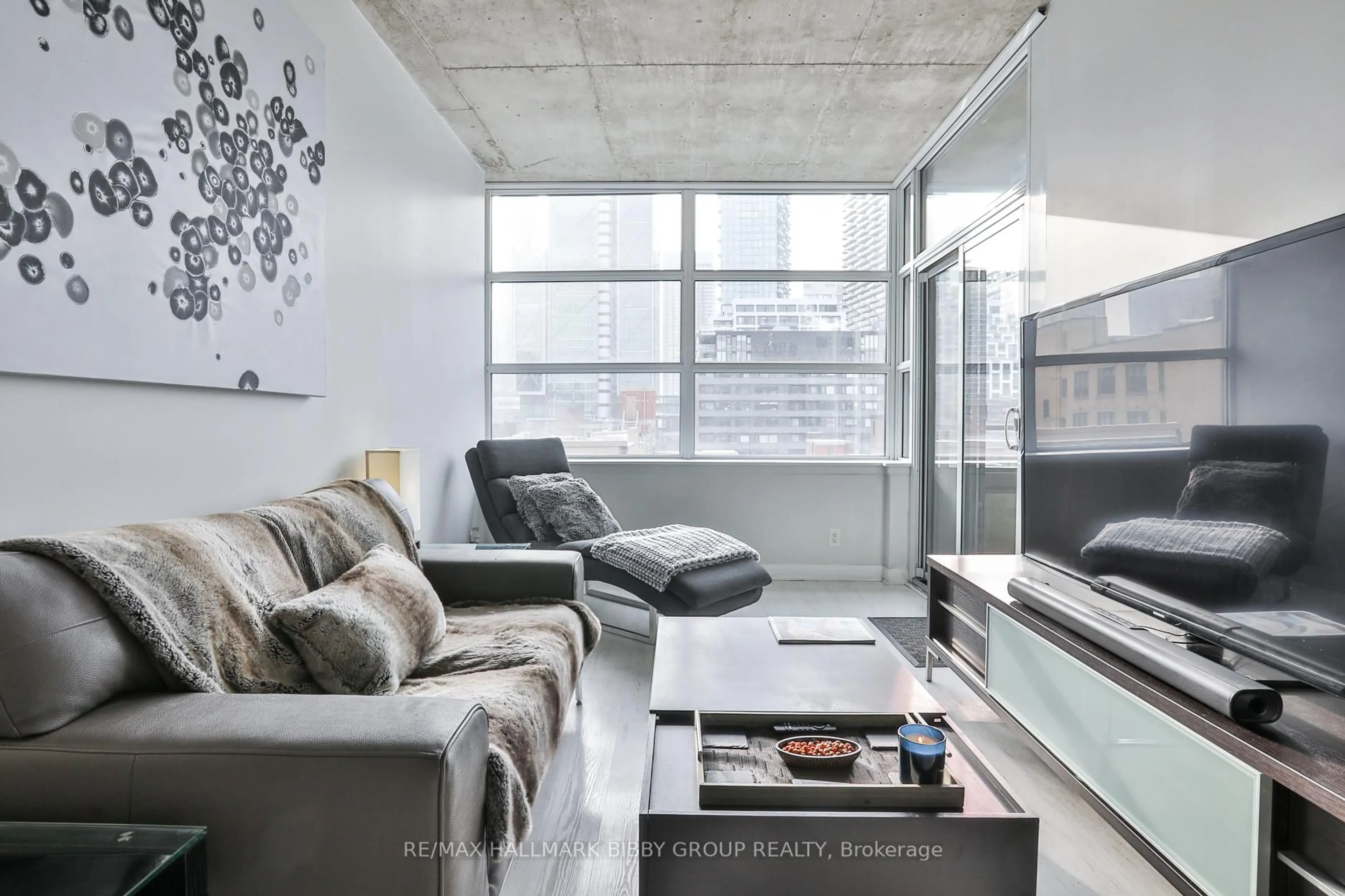 Living room with furniture, cement floor for 478 King St #606, Toronto Ontario M5V 0A8