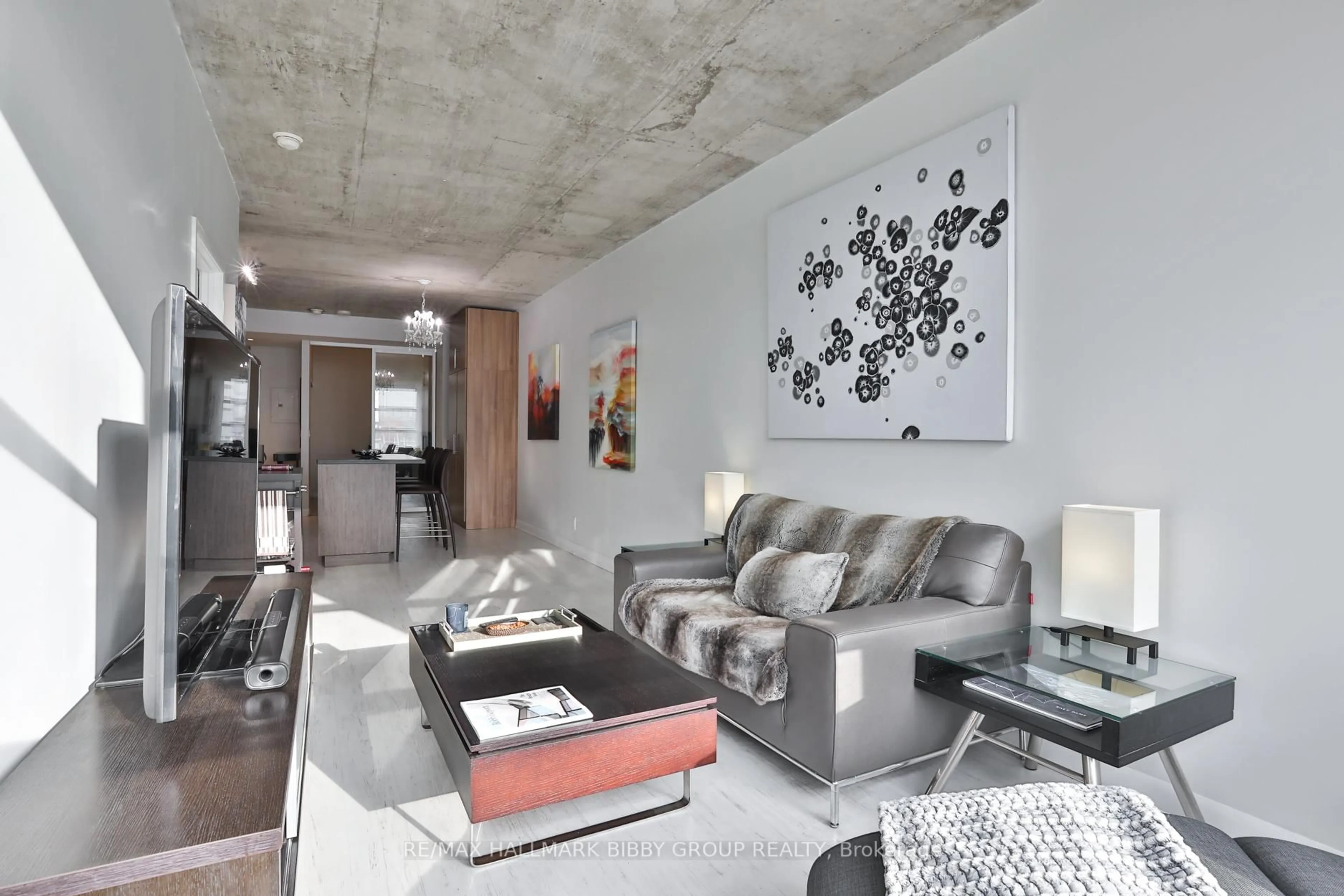 Living room with furniture, cement floor for 478 King St #606, Toronto Ontario M5V 0A8