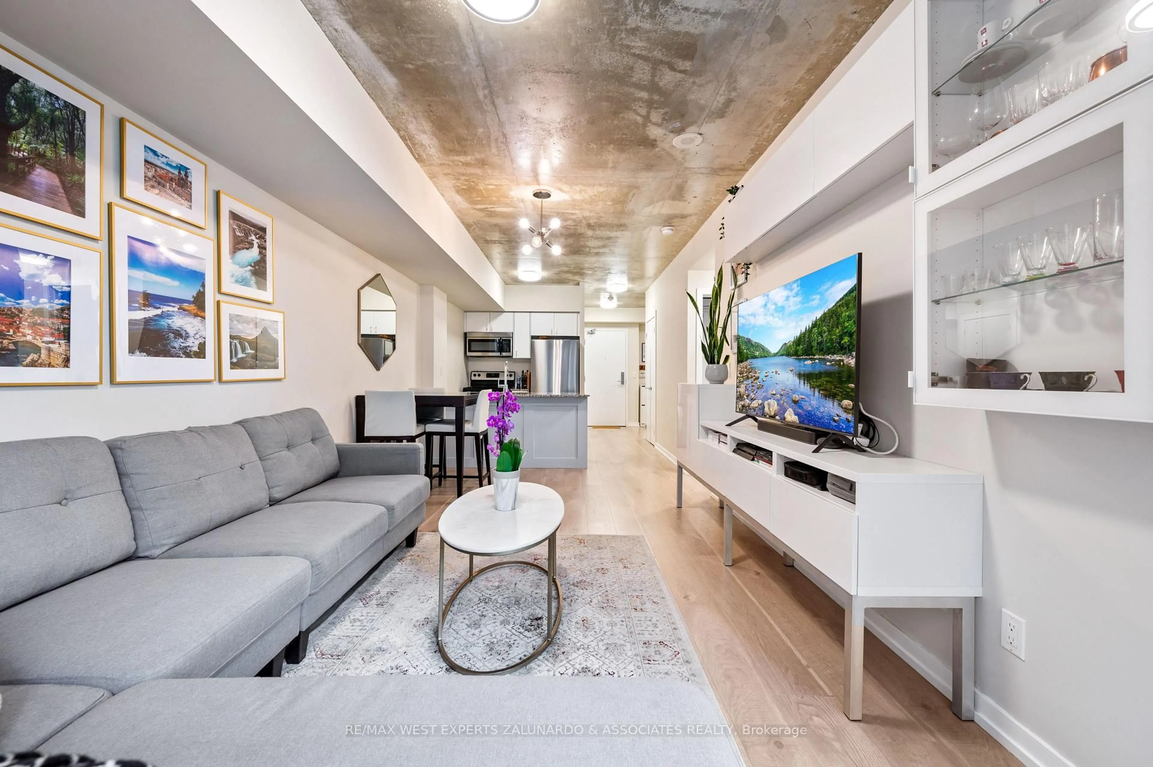 Living room with furniture, cement floor for 59 East Liberty St #315, Toronto Ontario M6K 3R1