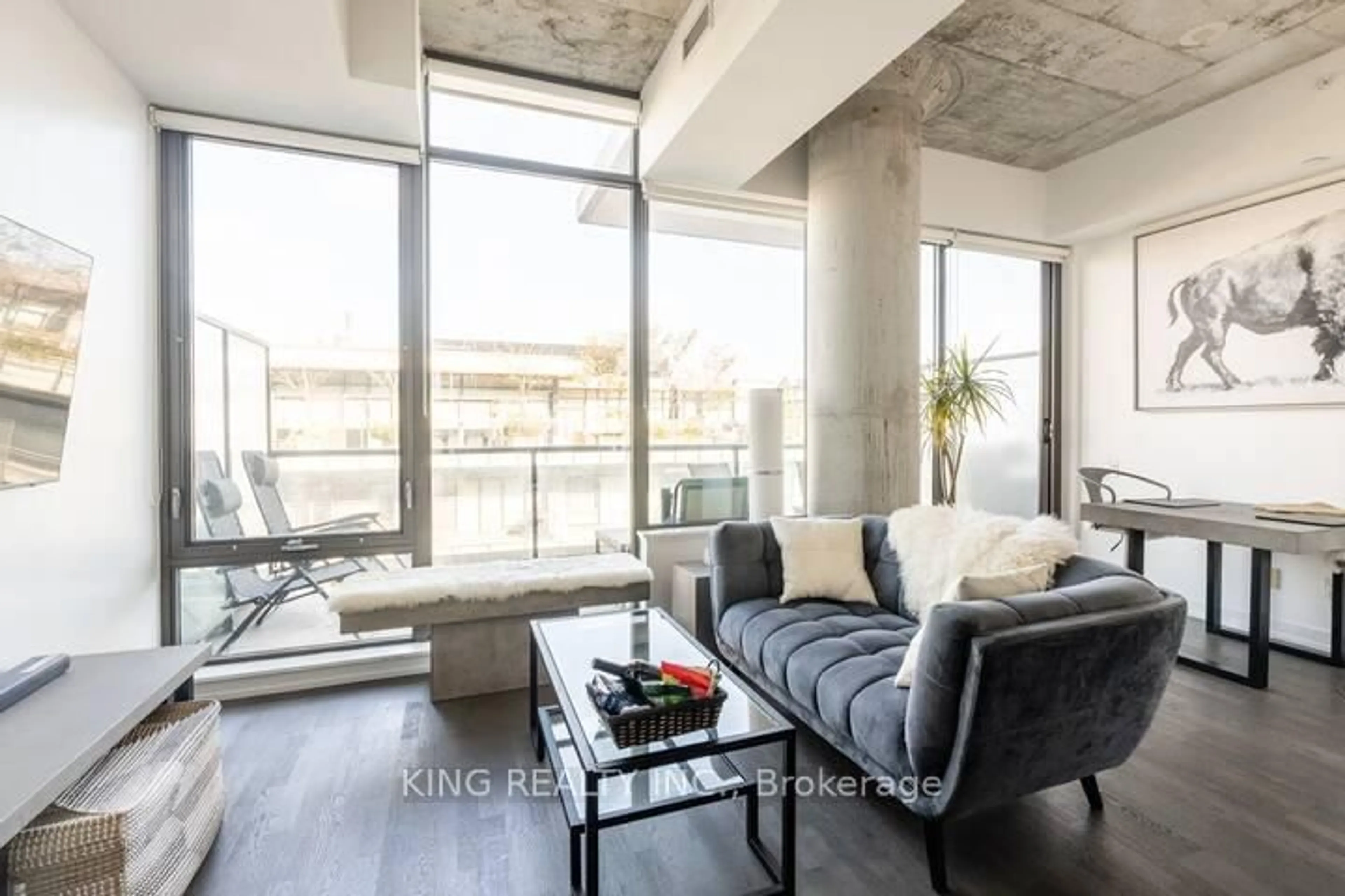 Living room with furniture, cement floor for 560 King St #1007, Toronto Ontario M5V 1M3