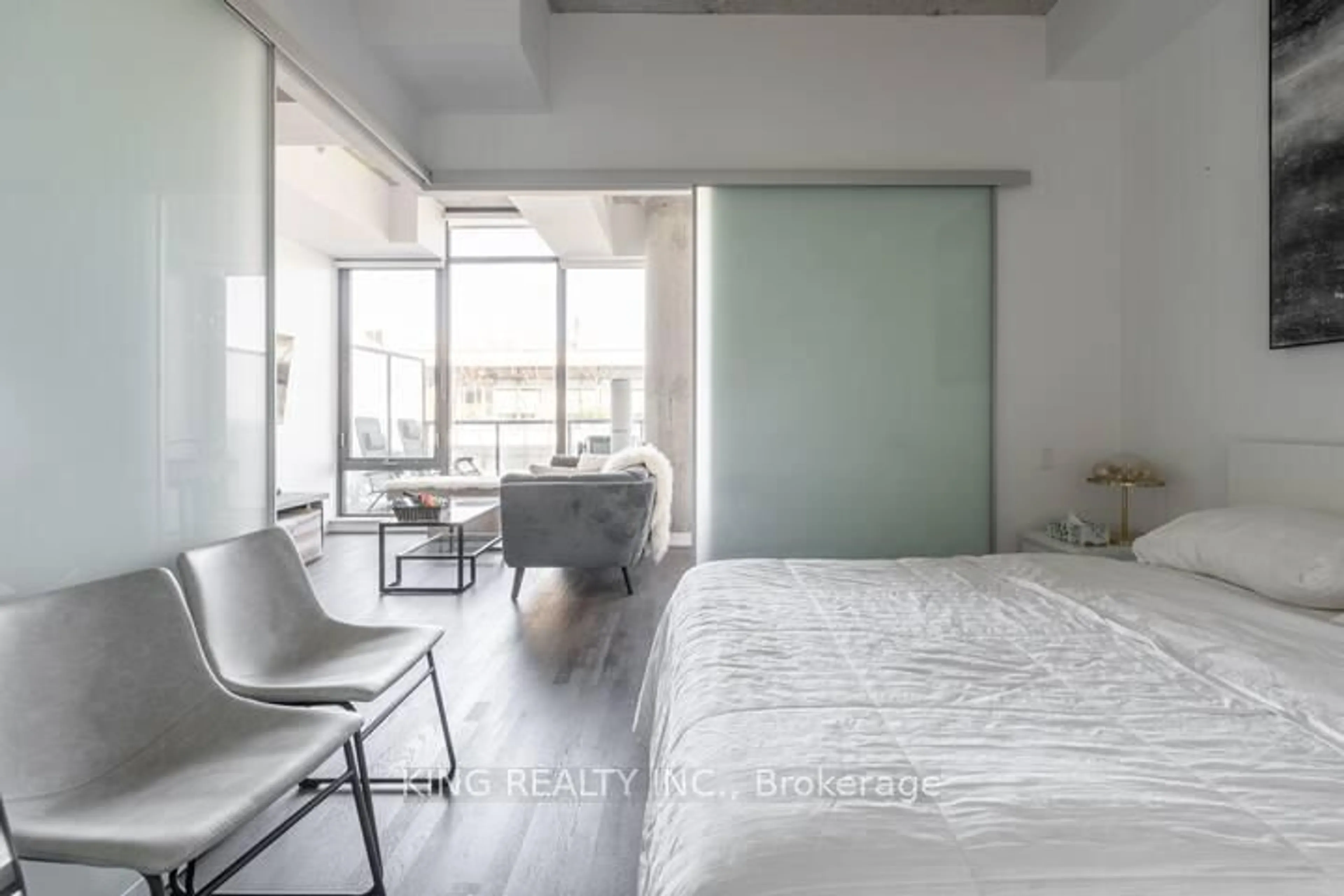 Bedroom with bed, cement floor for 560 King St #1007, Toronto Ontario M5V 1M3