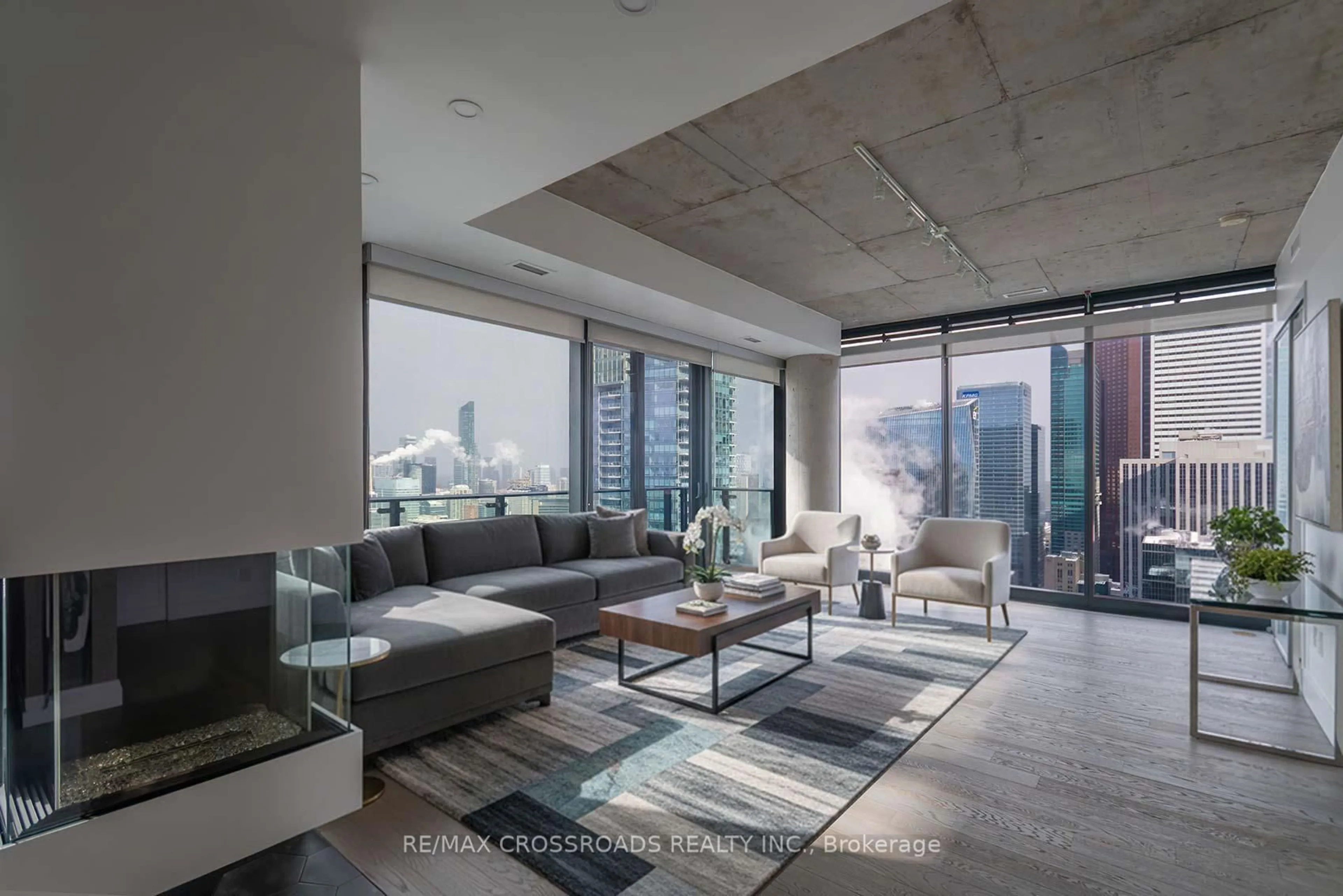 Living room with furniture, cement floor for 224 King St #4401, Toronto Ontario M5V 1H8