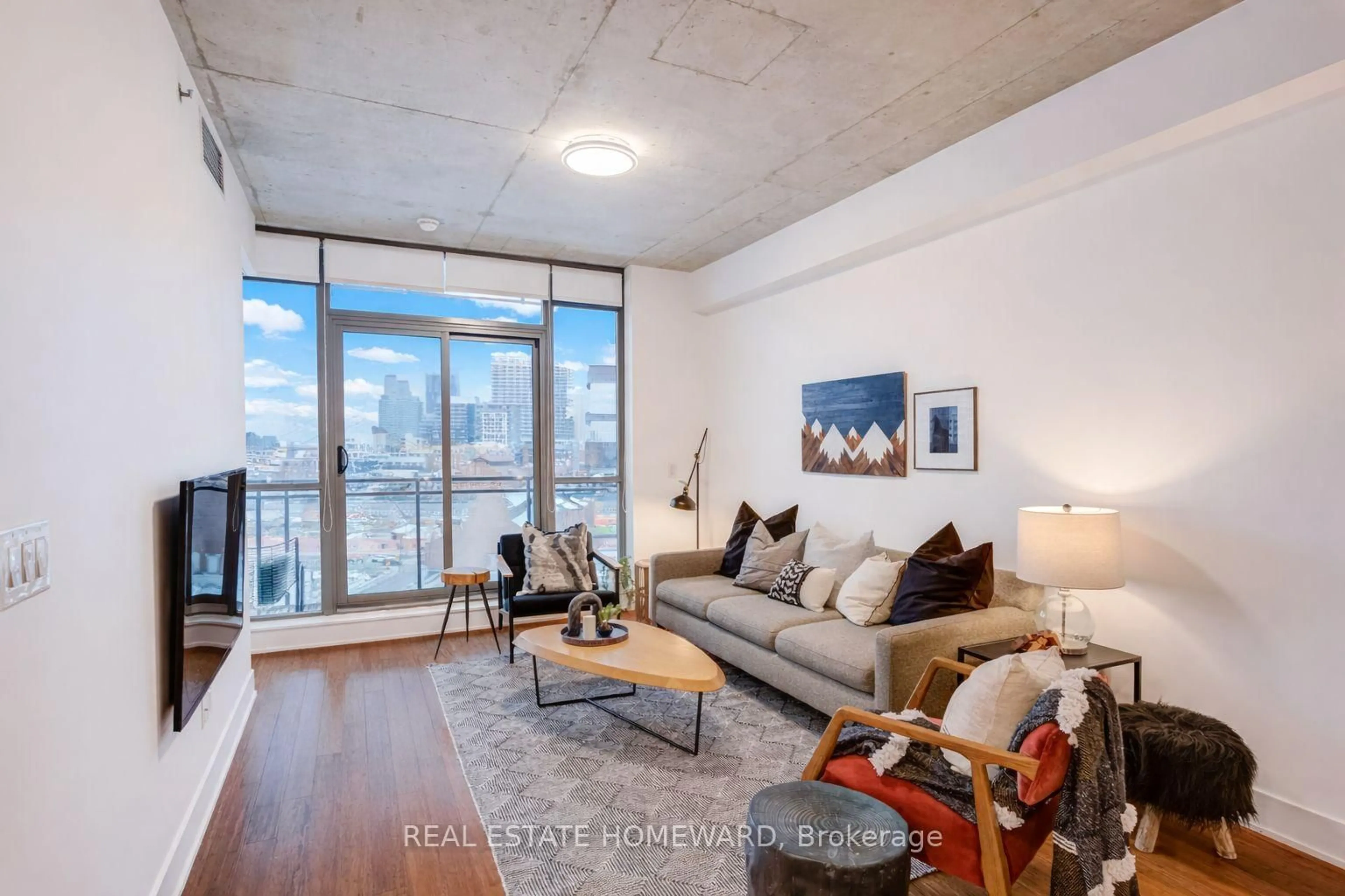 Living room with furniture, unknown for 90 Trinity St #709, Toronto Ontario M5A 0E4