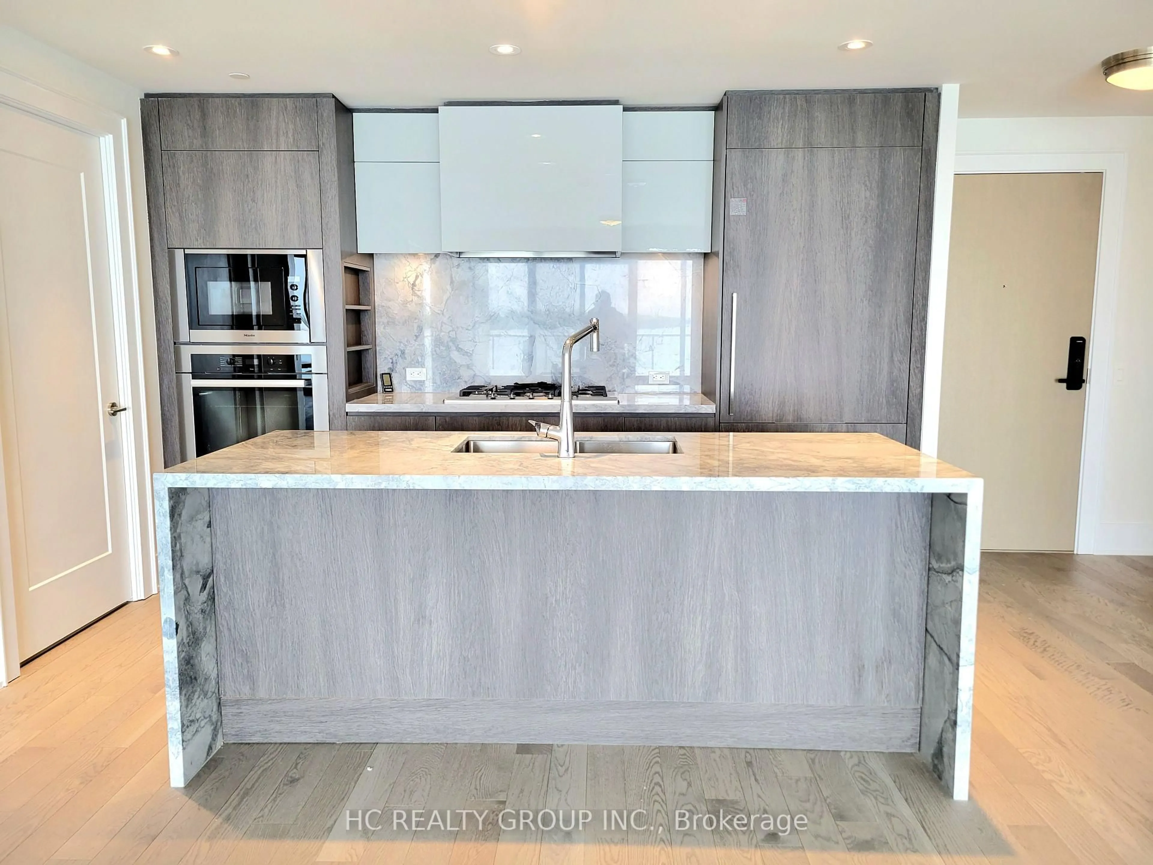 Contemporary kitchen, cement floor for 118 Merchants Wharf Ave #309, Toronto Ontario M5A 0L3