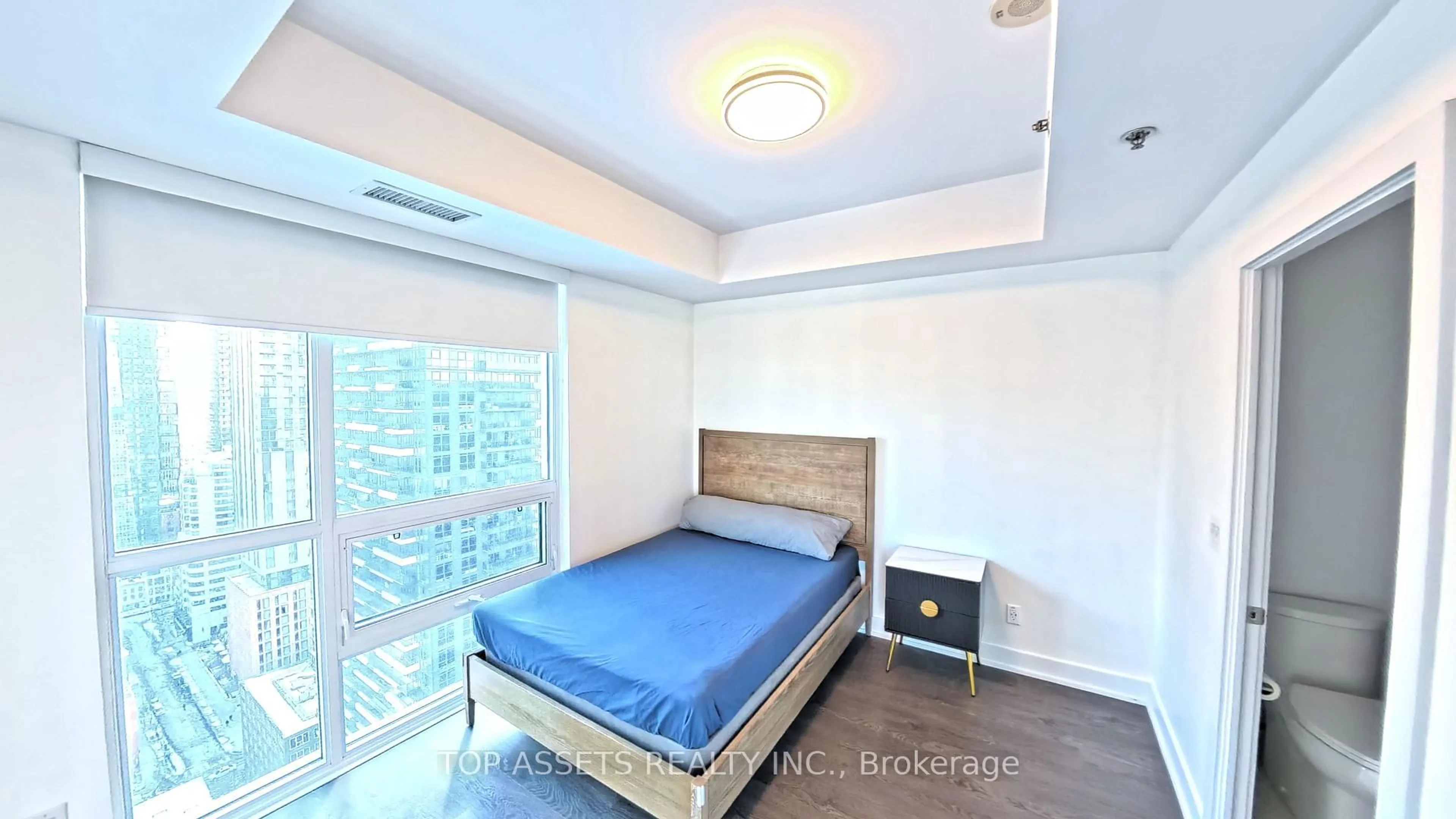 Bedroom with bed, wood/laminate floor for 318 Richmond St #3006, Toronto Ontario M5V 0B4