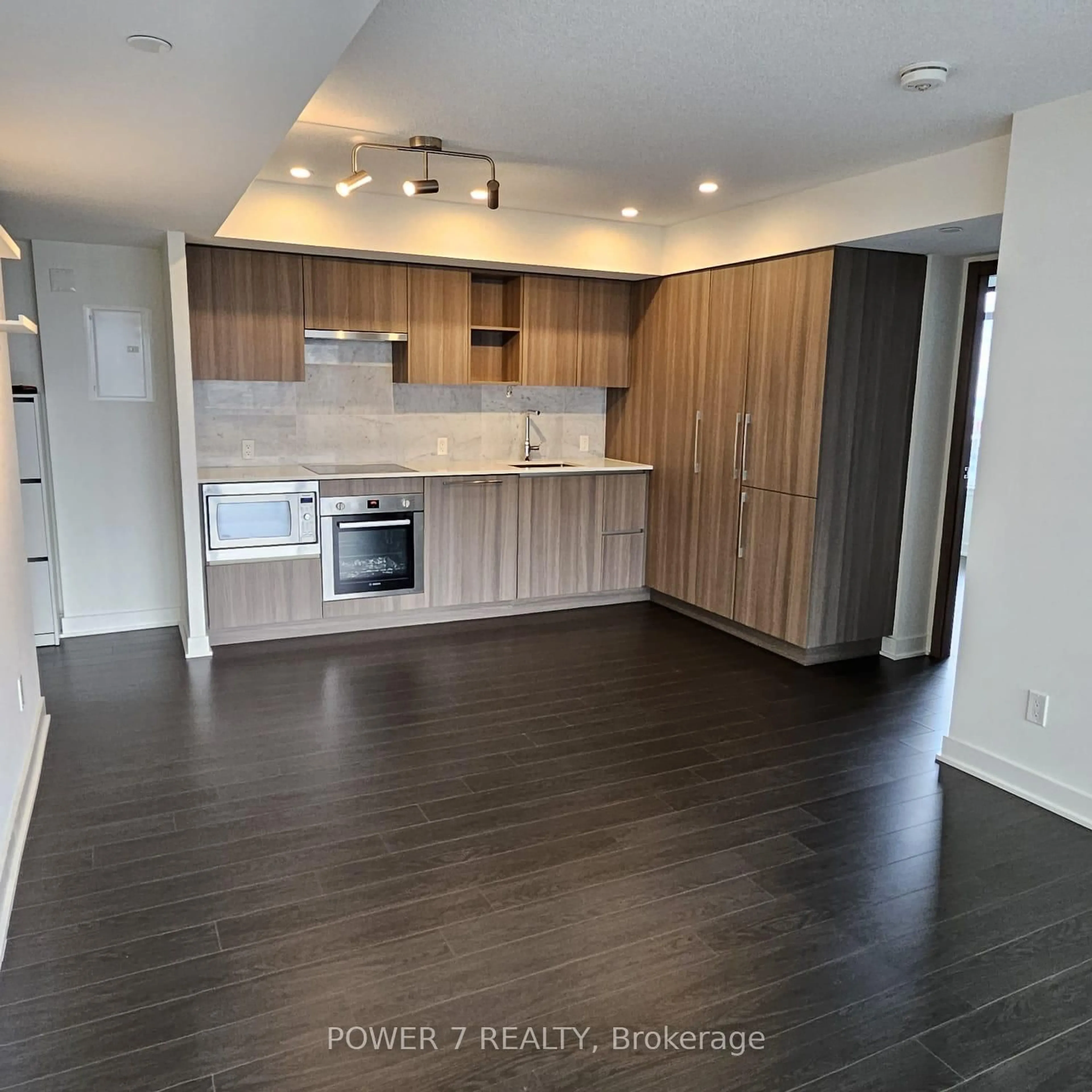 Open concept kitchen, wood/laminate floor for 19 Bathurst St #2303, Toronto Ontario M5V 0N2