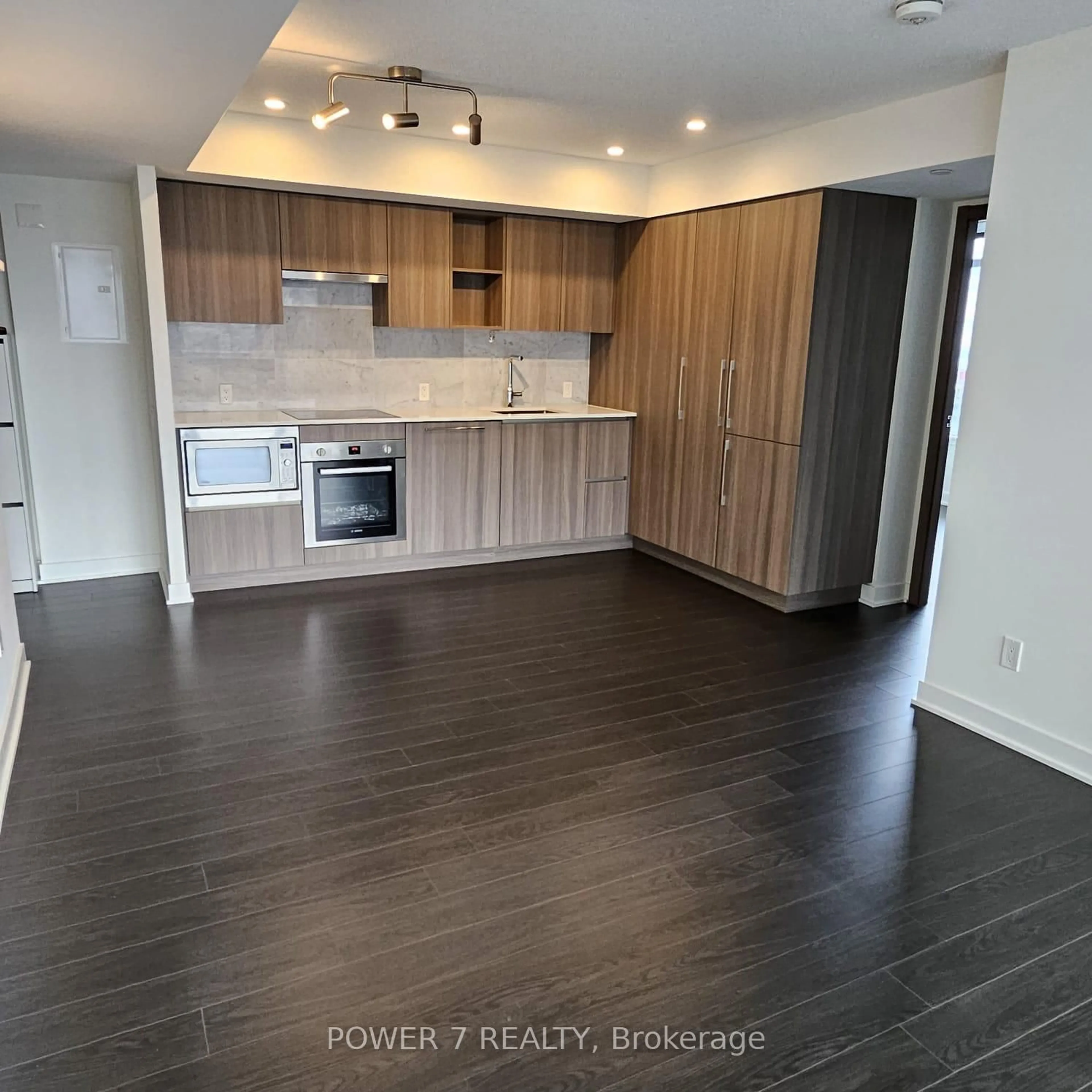 Open concept kitchen, wood/laminate floor for 19 Bathurst St #2303, Toronto Ontario M5V 0N2