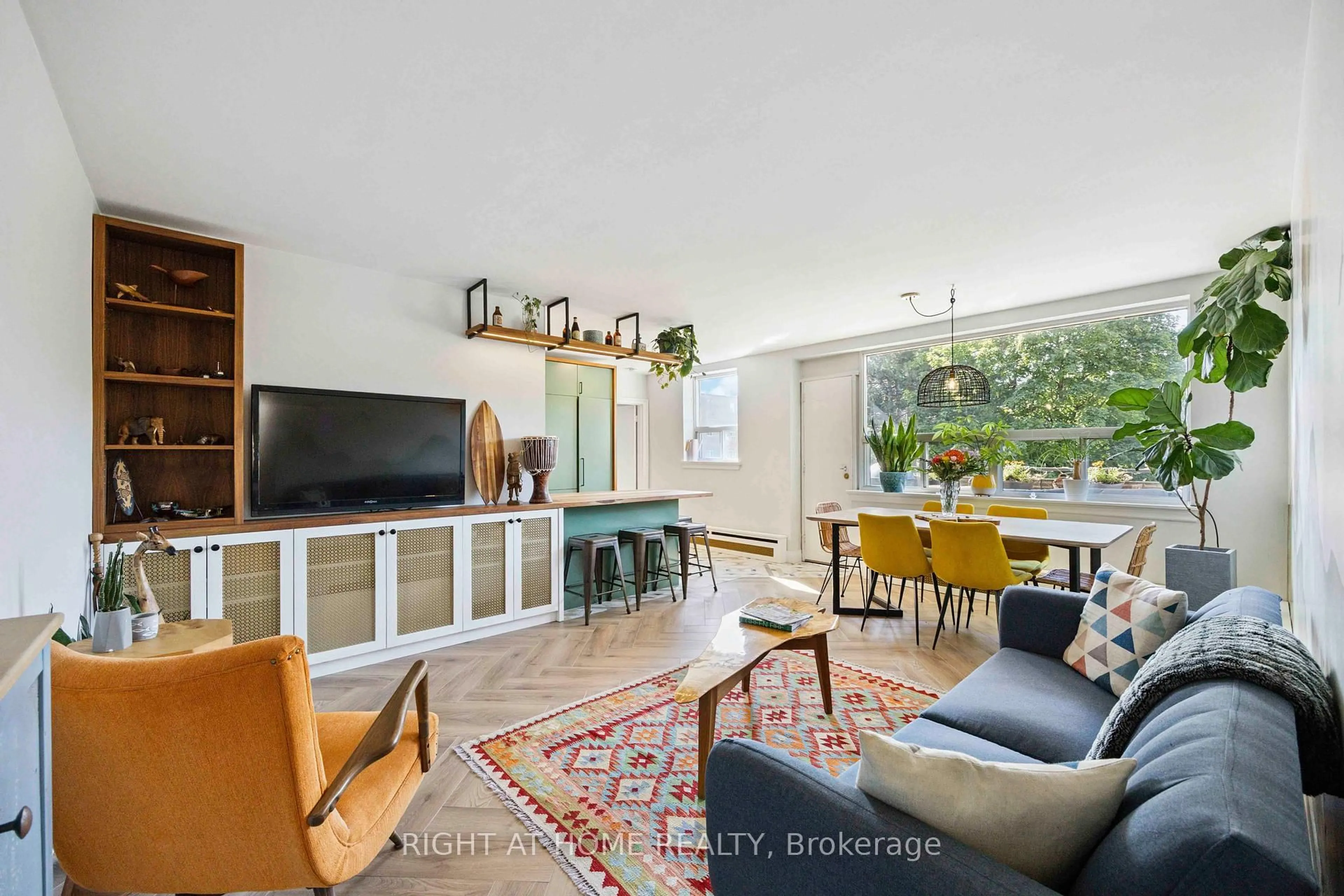 Living room with furniture, unknown for 57 Neptune Dr #103, Toronto Ontario M6A 1X2