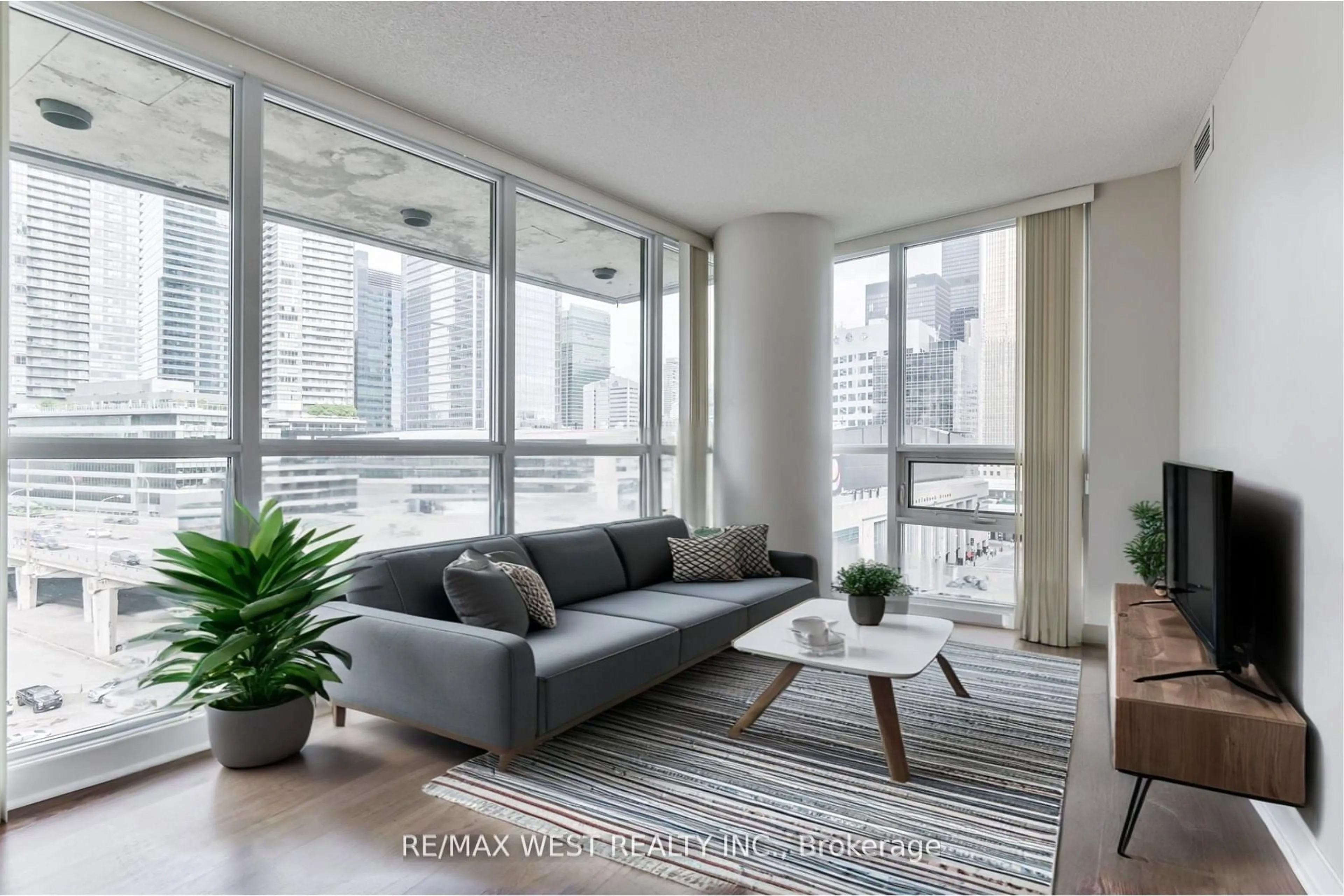 Living room with furniture, unknown for 33 Bay St #903, Toronto Ontario M5J 2Z3