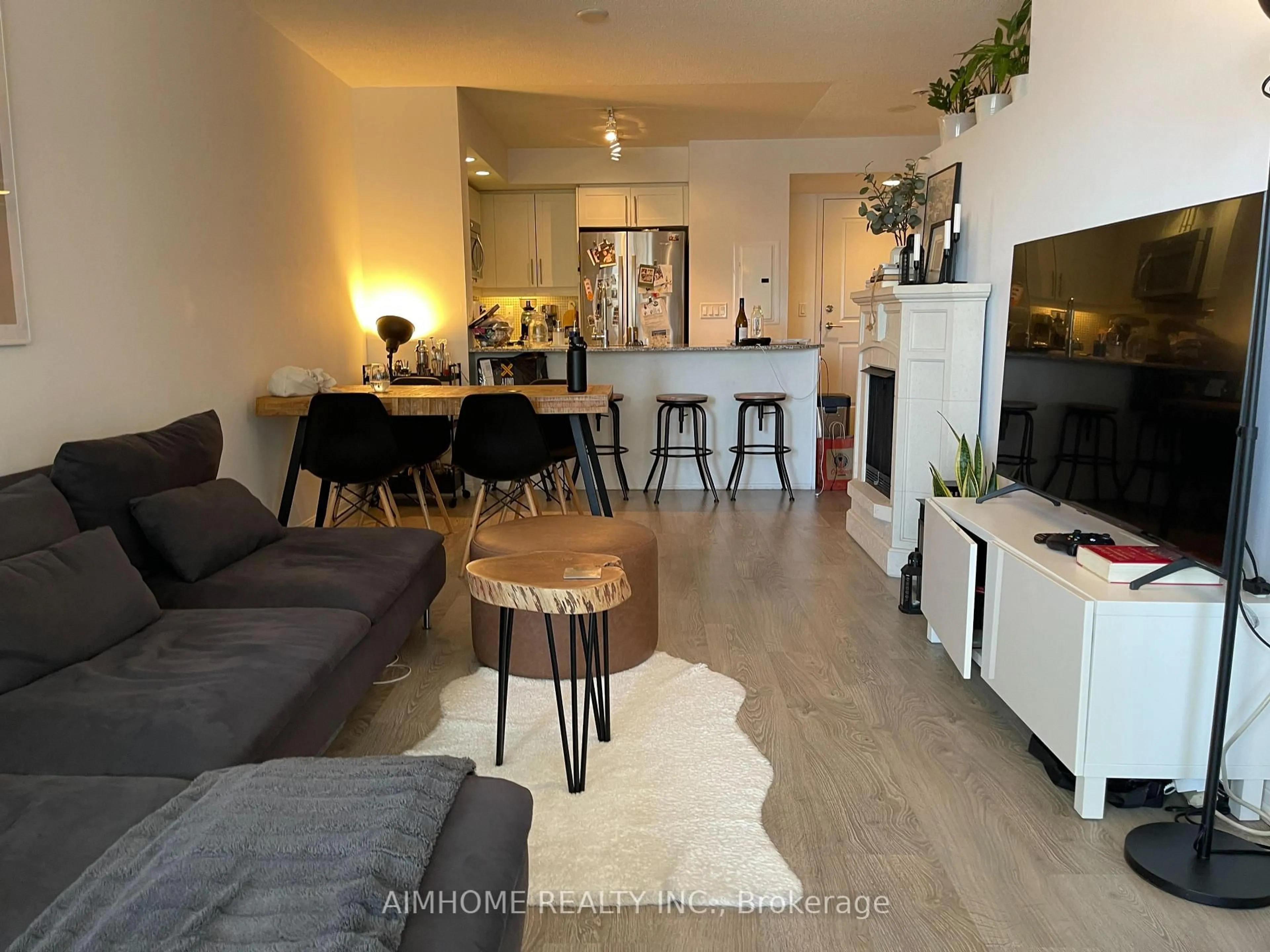 Living room with furniture, wood/laminate floor for 85 East Liberty St #907, Toronto Ontario M6K 3R4