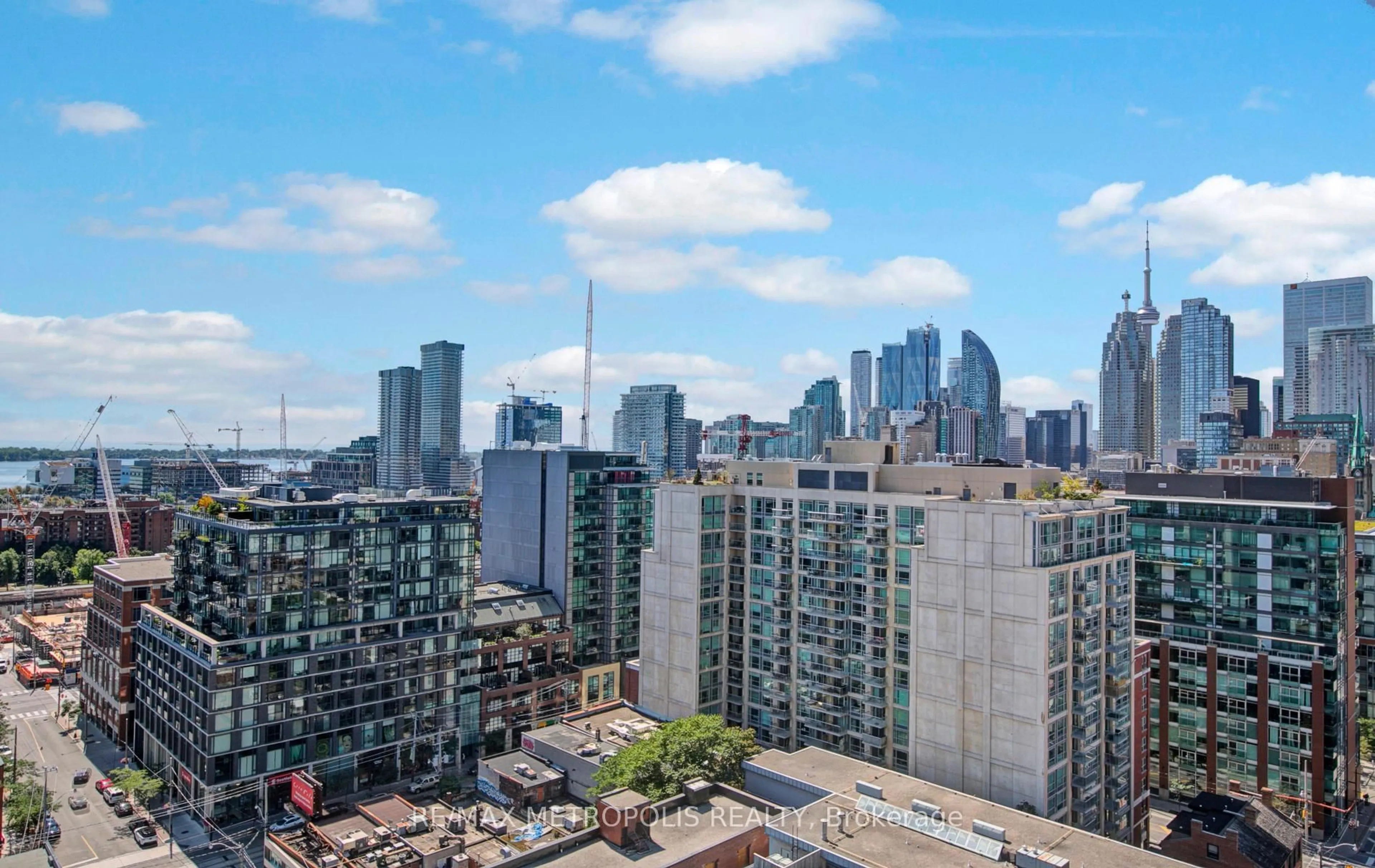 Patio, city buildings view from balcony for 460 Adelaide St #1606, Toronto Ontario M5A 0E7