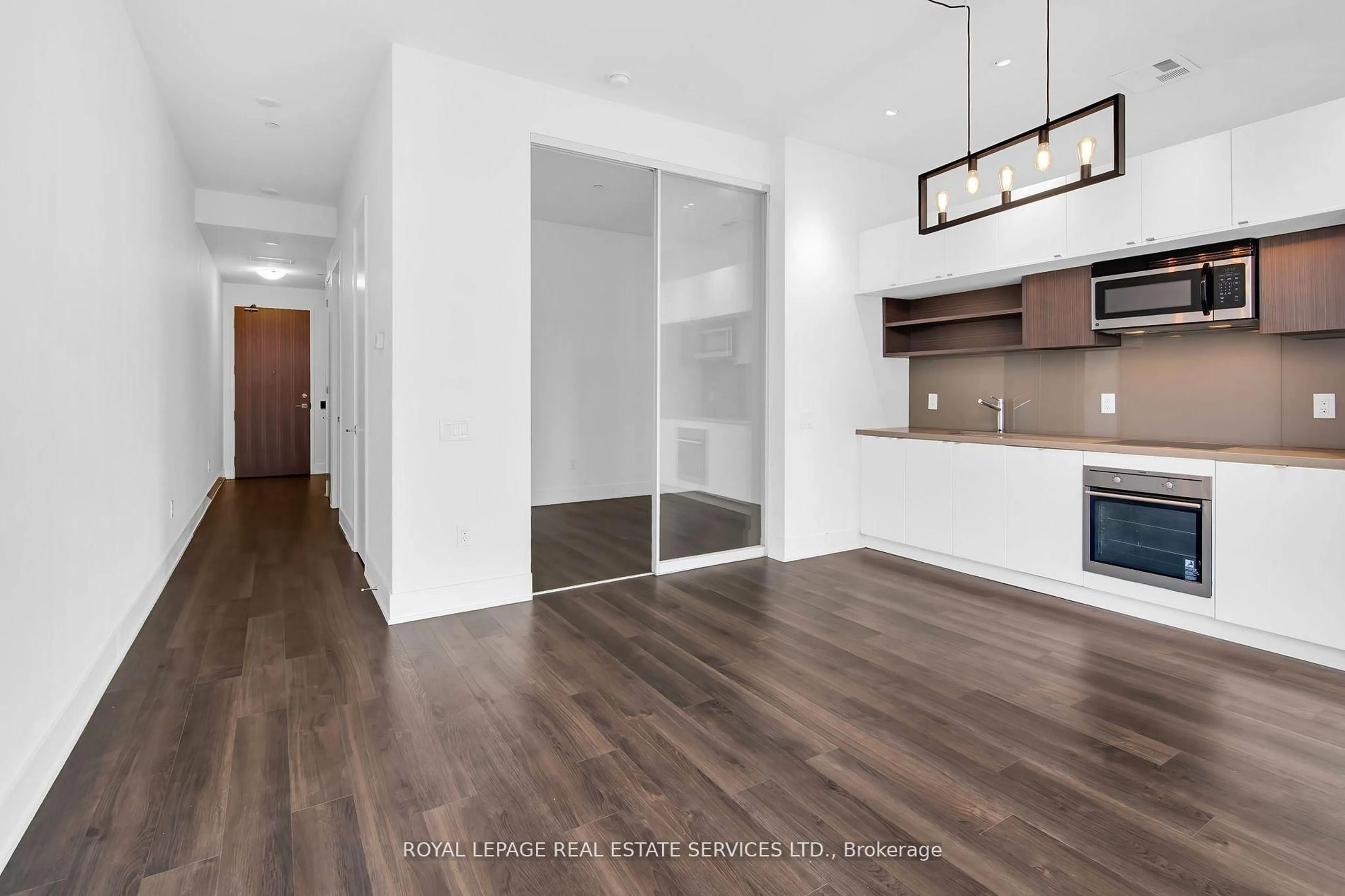 Open concept kitchen, wood/laminate floor for 111 St Clair Ave #402, Toronto Ontario M4V 1N5