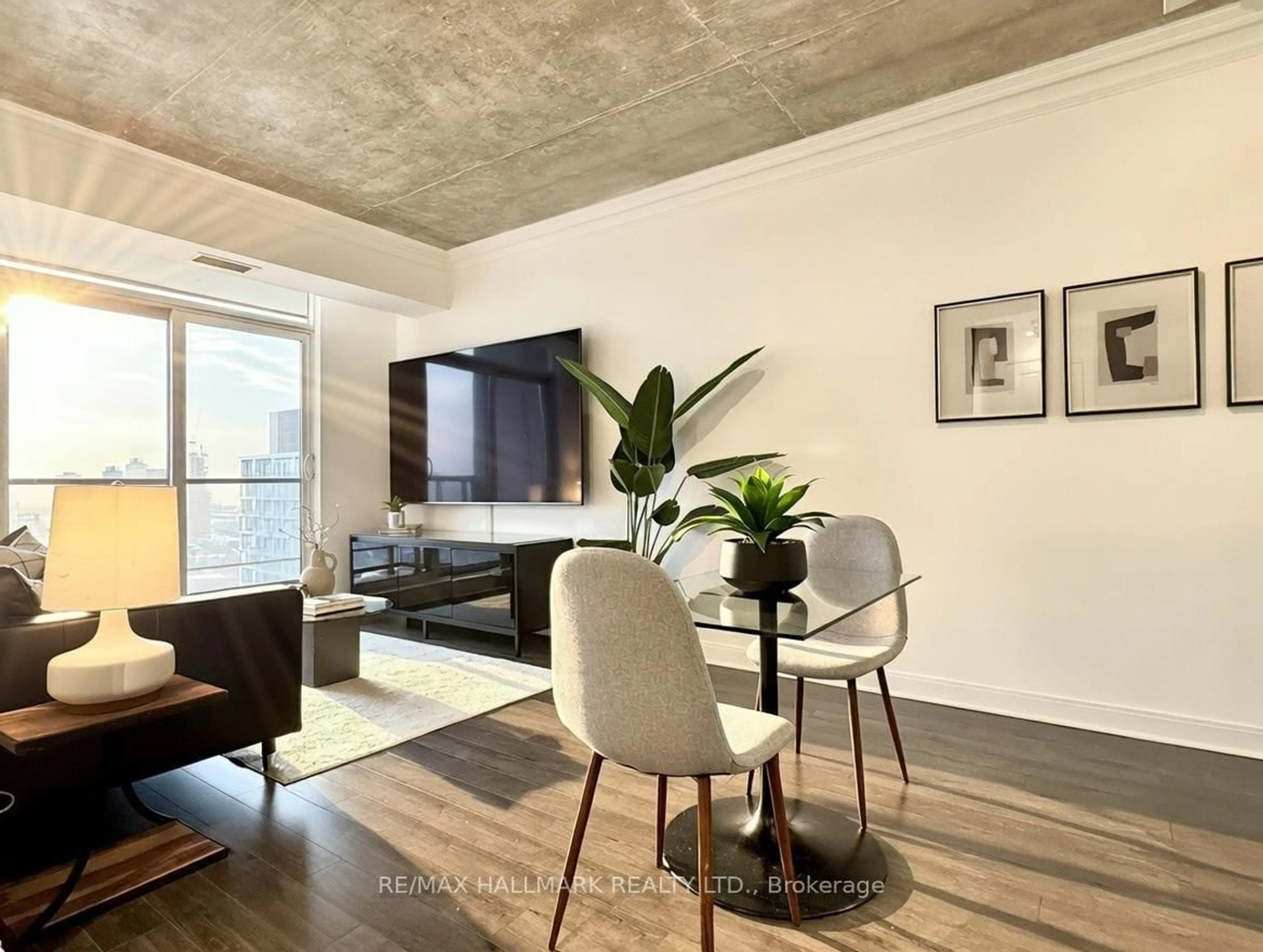 Living room with furniture, cement floor for 1 Scott St #3001, Toronto Ontario M5E 1A1