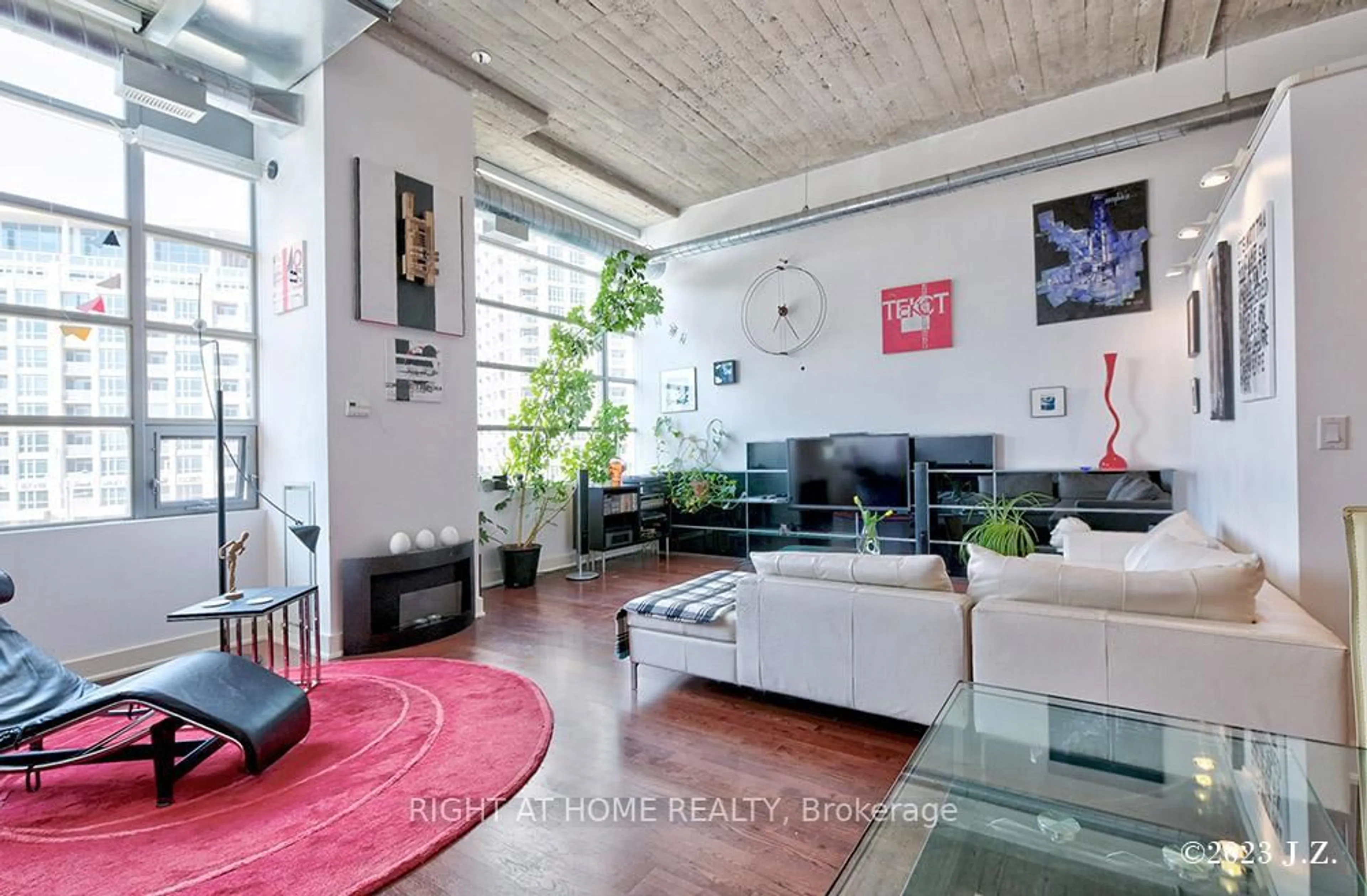 Living room with furniture, cement floor for 637 Lake Shore Blvd #217, Toronto Ontario M5V 1A8