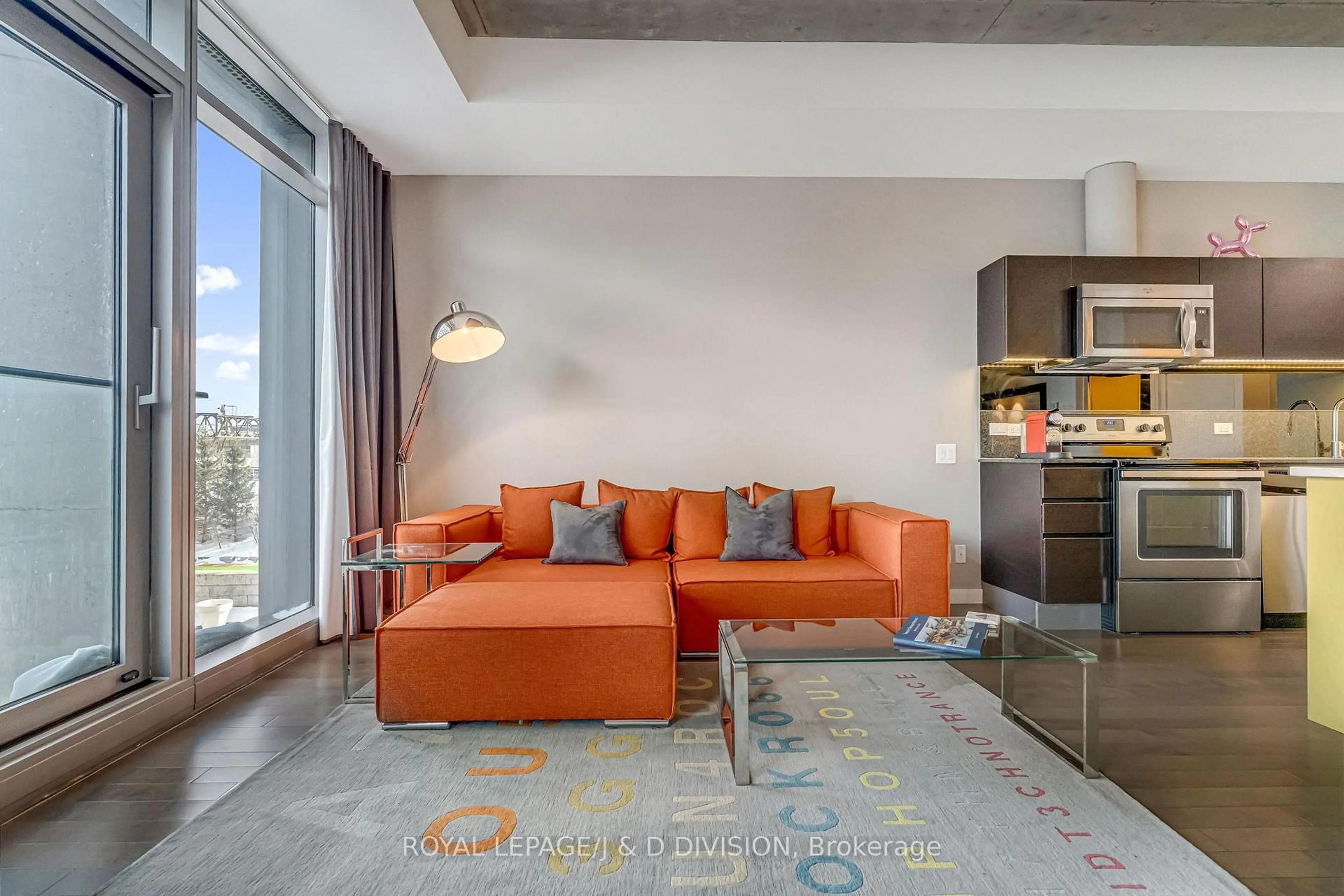 Living room with furniture, cement floor for 70 Distillery Lane #314, Toronto Ontario M5A 0E3