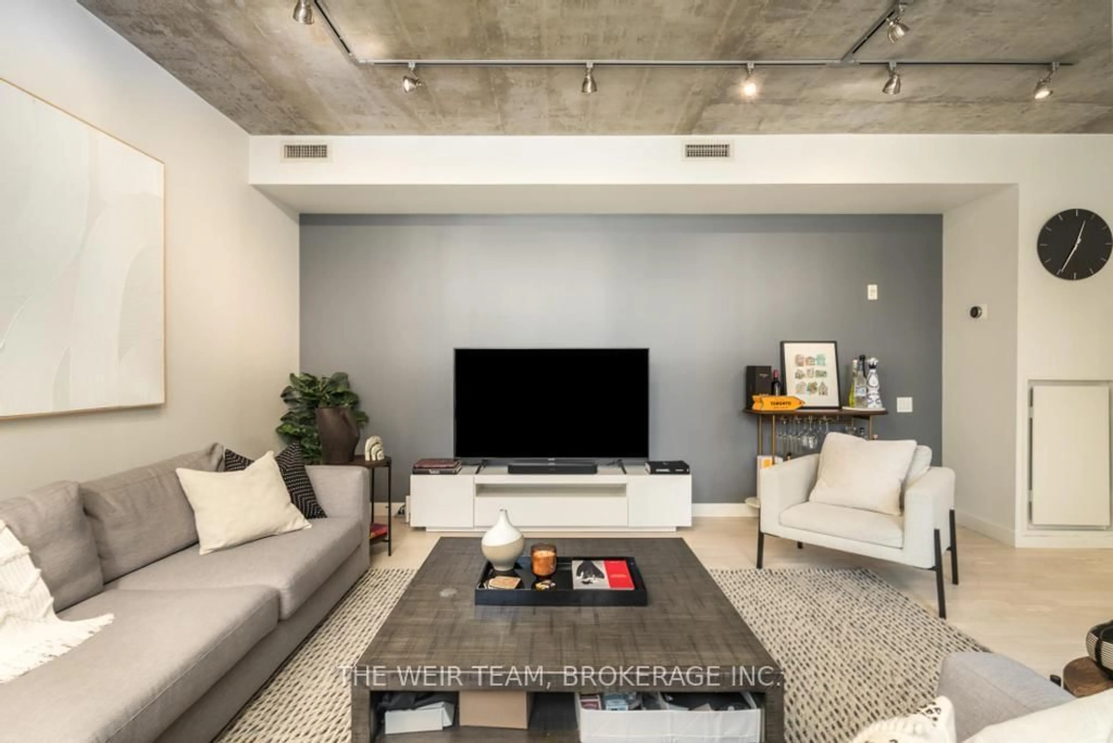 Living room with furniture, cement floor for 75 Portland St, Toronto Ontario M5V 2M9