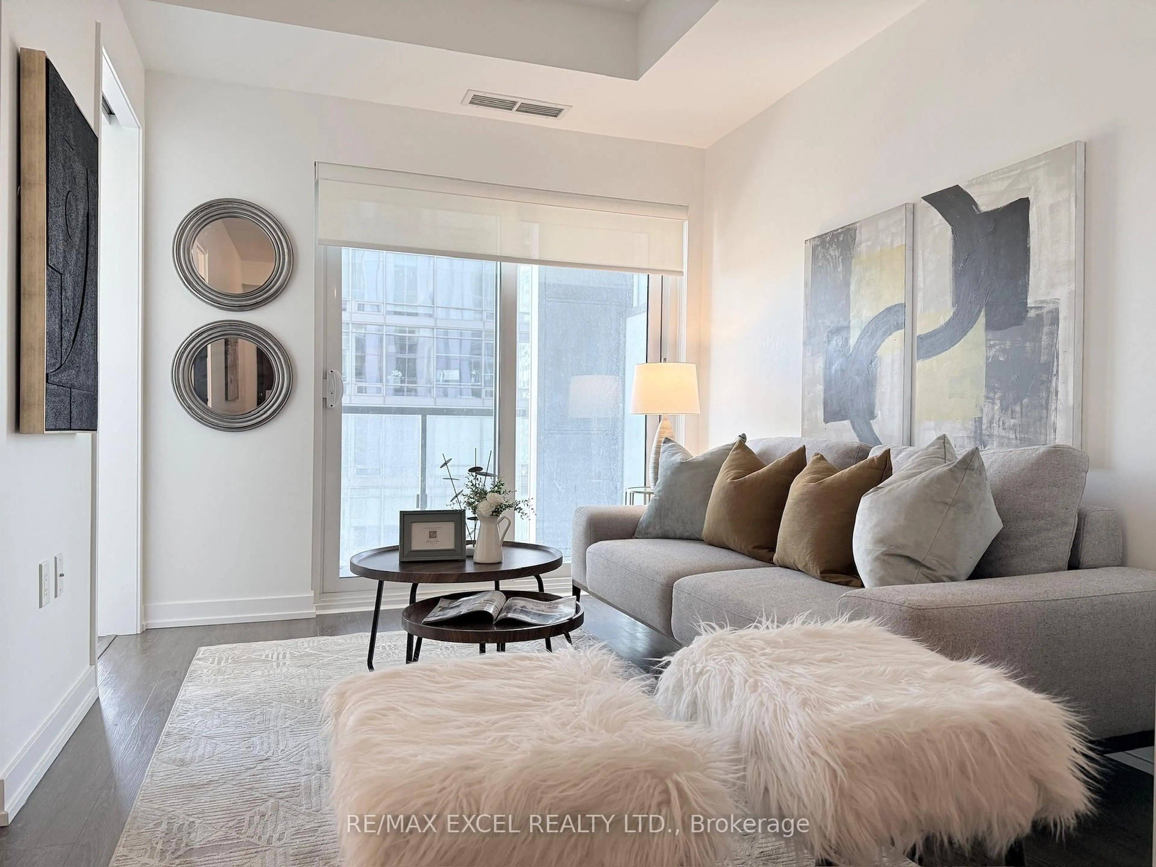 Living room with furniture, carpet floor for 1 Yorkville Ave #2806, Toronto Ontario M4W 1L1