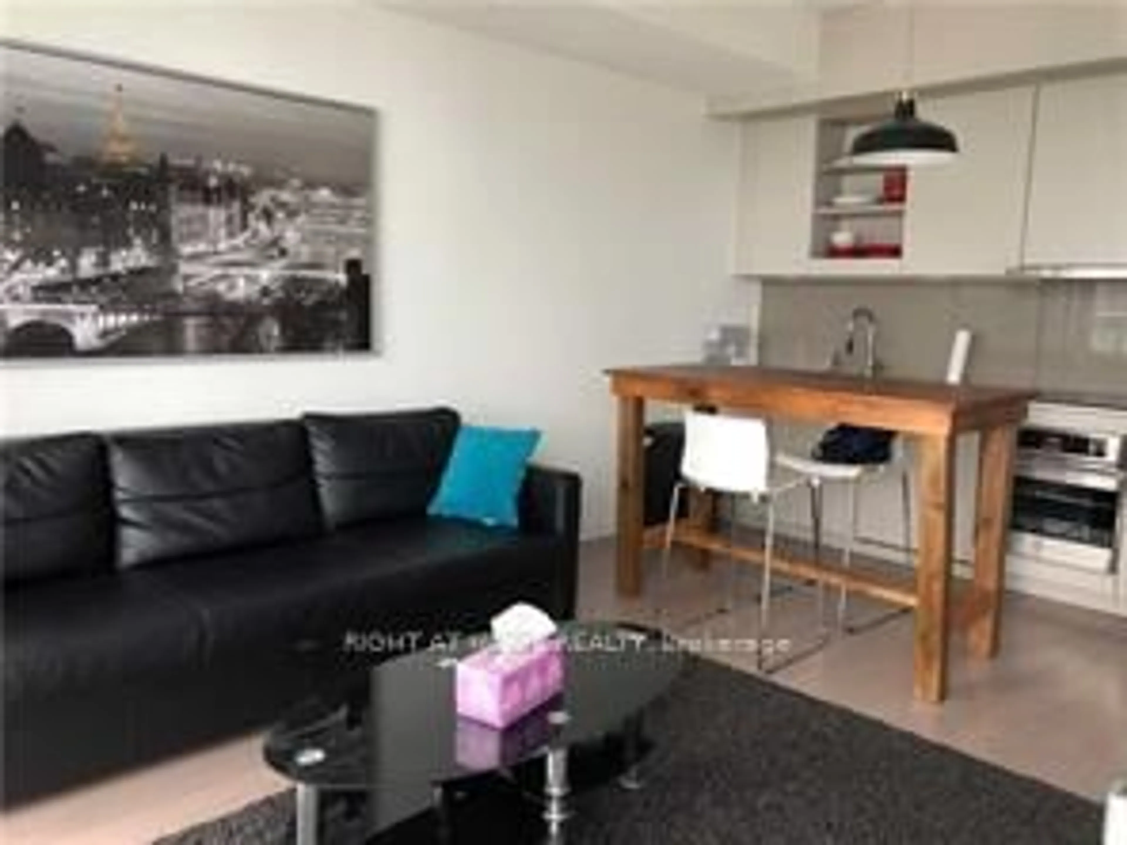 Living room with furniture, wood/laminate floor for 101 Peter St #3907, Toronto Ontario M5V 2G9