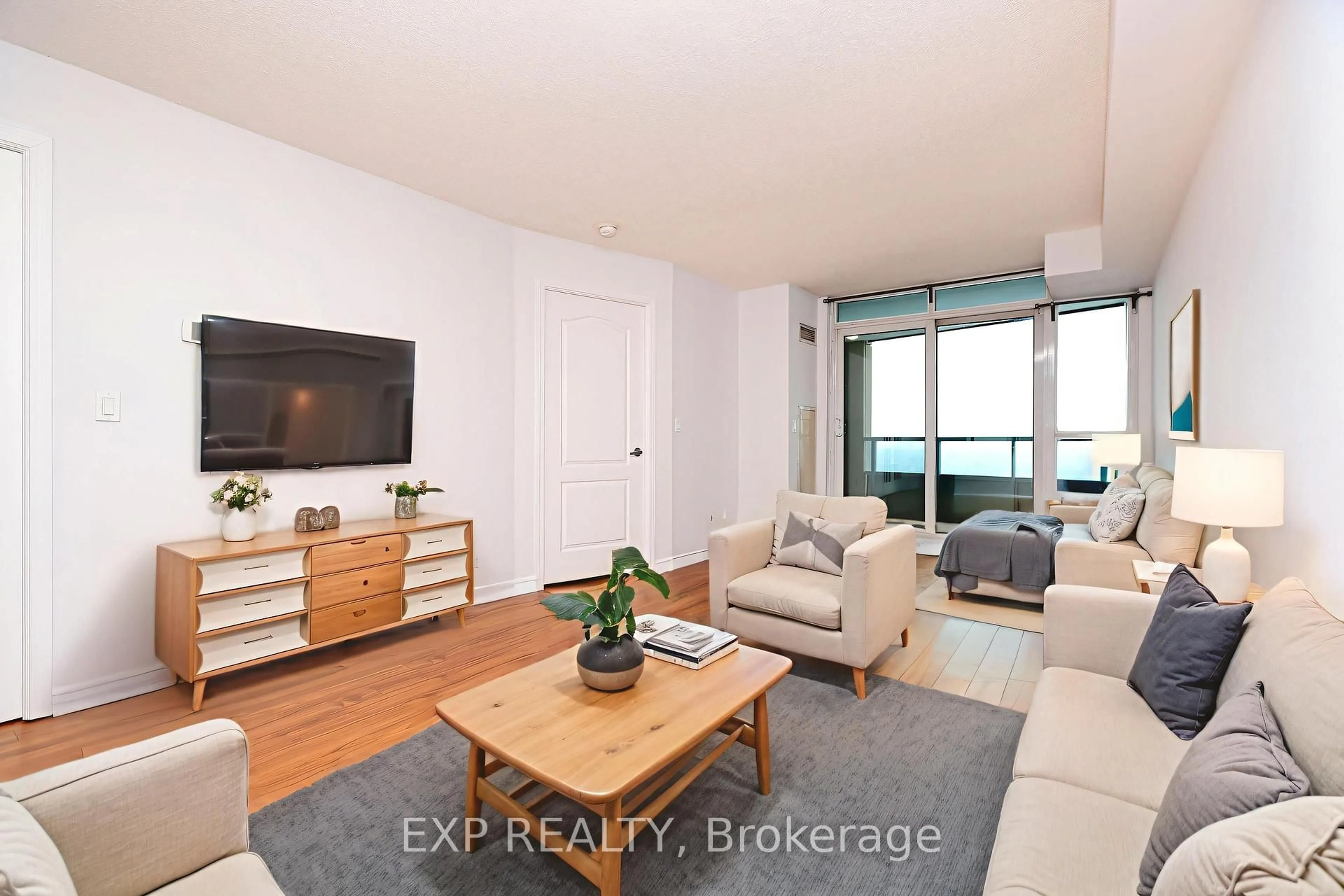 Living room with furniture, wood/laminate floor for 17 Barberry Pl #1909, Toronto Ontario M2K 3E2