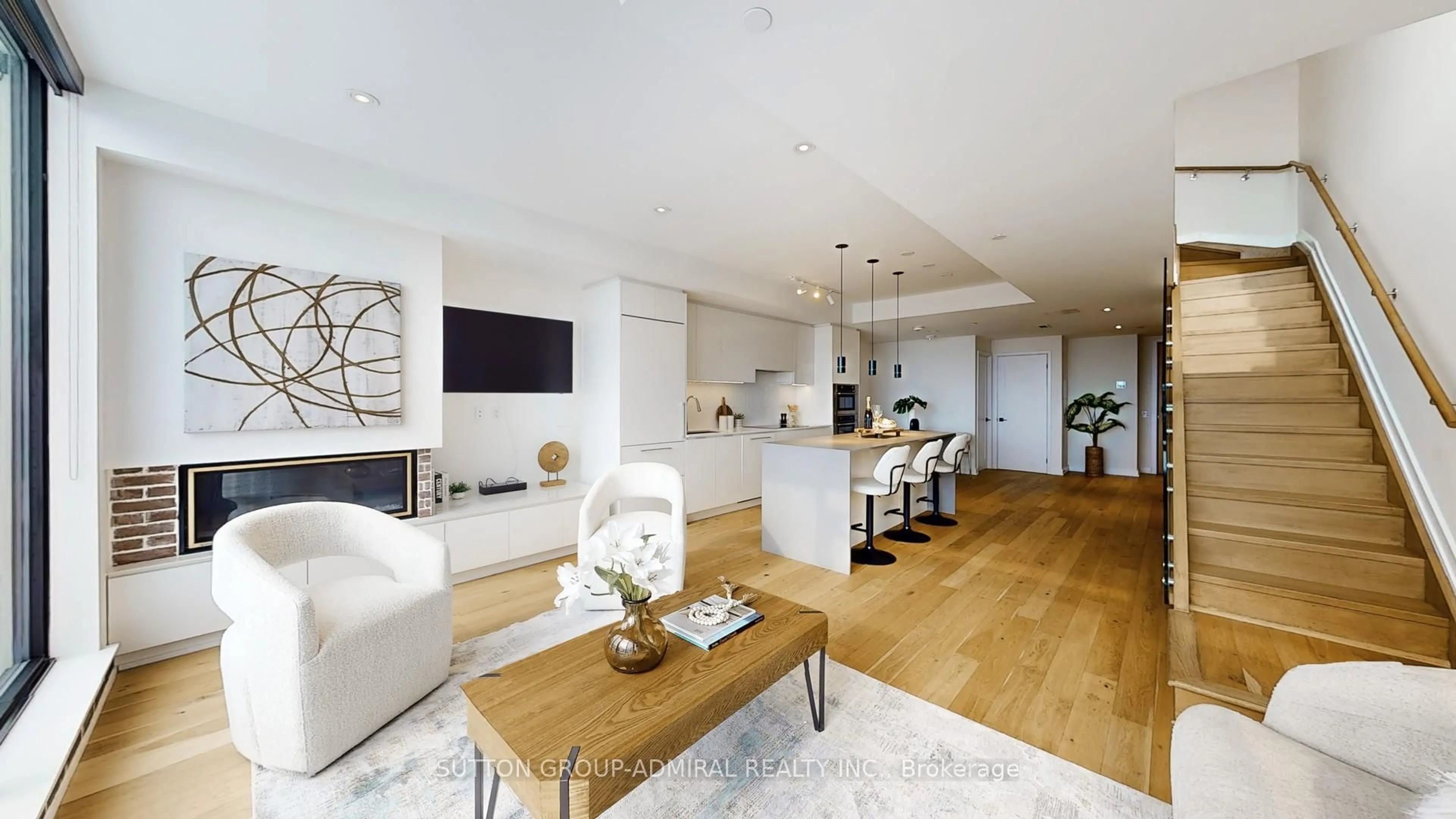 Living room with furniture, wood/laminate floor for 899 College St #617, Toronto Ontario M6H 1A1