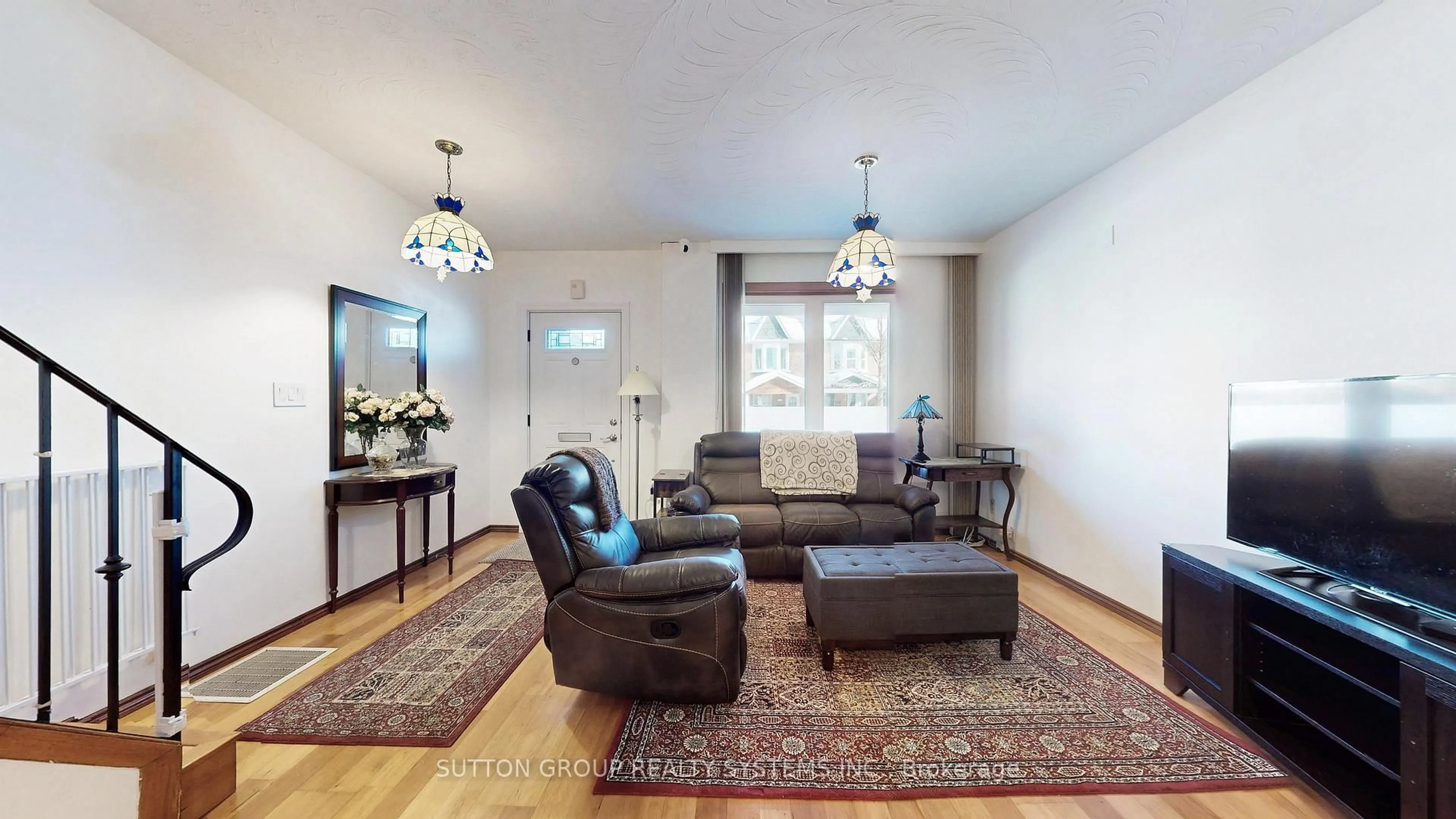 Living room with furniture, wood/laminate floor for 1180 Ossington Ave, Toronto Ontario M6G 3W1