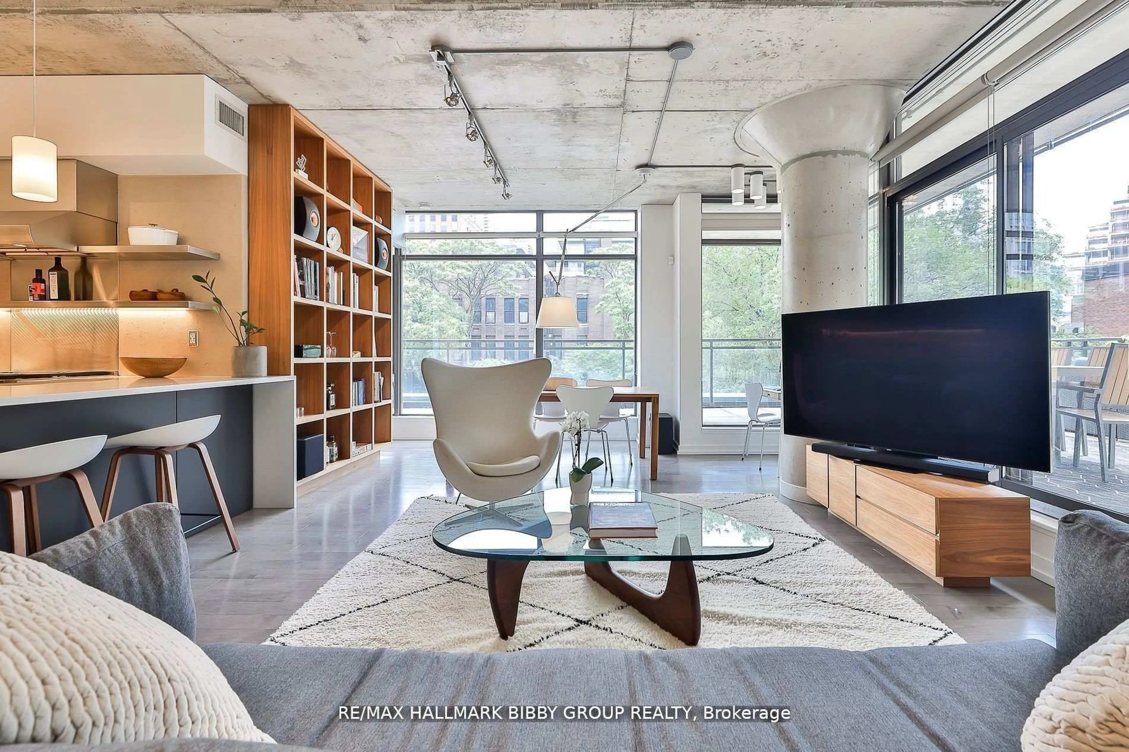 Living room with furniture, cement floor for 10 Morrison St #305, Toronto Ontario M5V 2T8