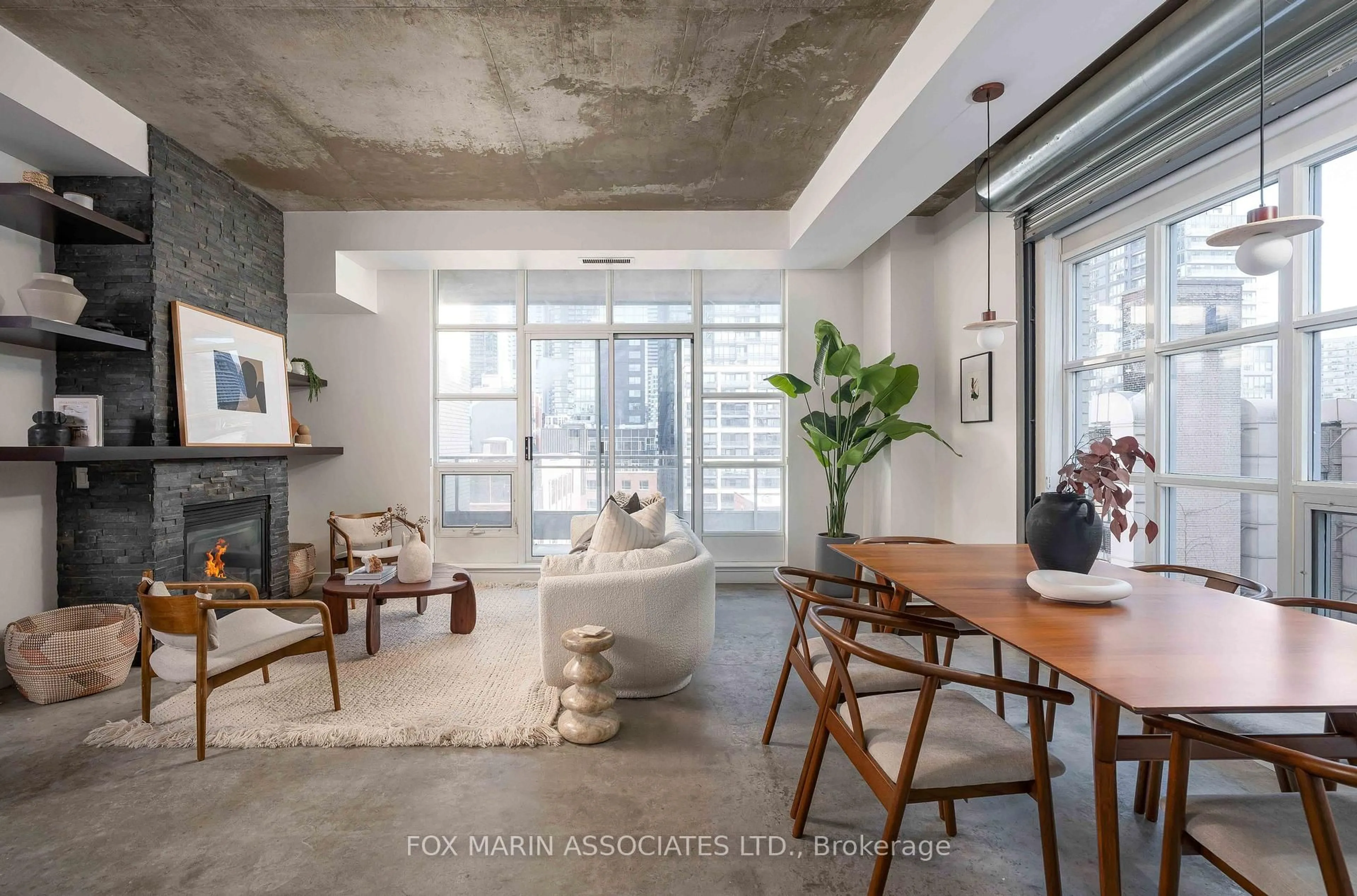 Living room with furniture, cement floor for 23 Brant St #703, Toronto Ontario M5V 2L5