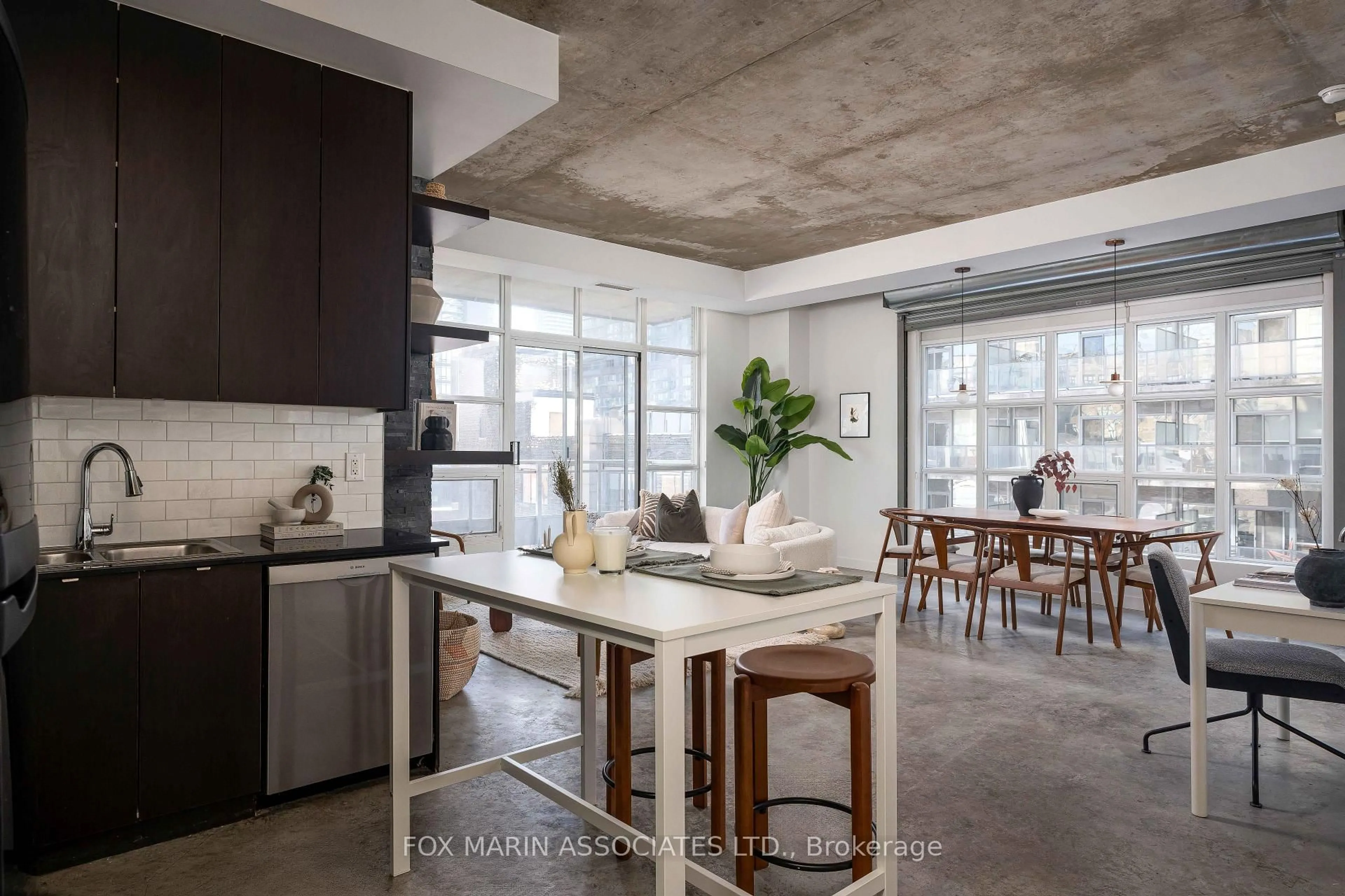 Open concept kitchen, cement floor for 23 Brant St #703, Toronto Ontario M5V 2L5