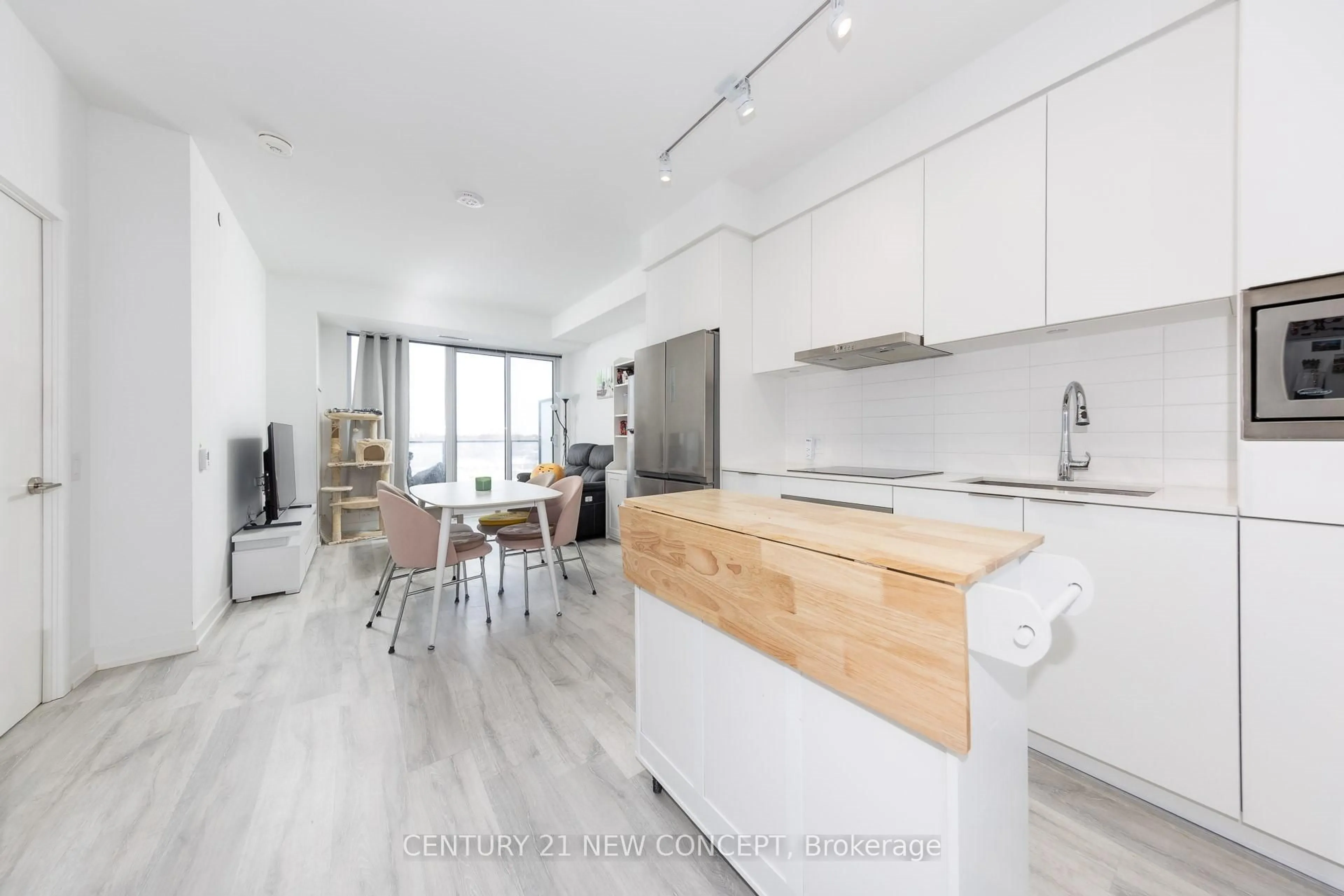 Open concept kitchen, wood/laminate floor for 7 Golden Lion Hts #544, Toronto Ontario M2M 0C1